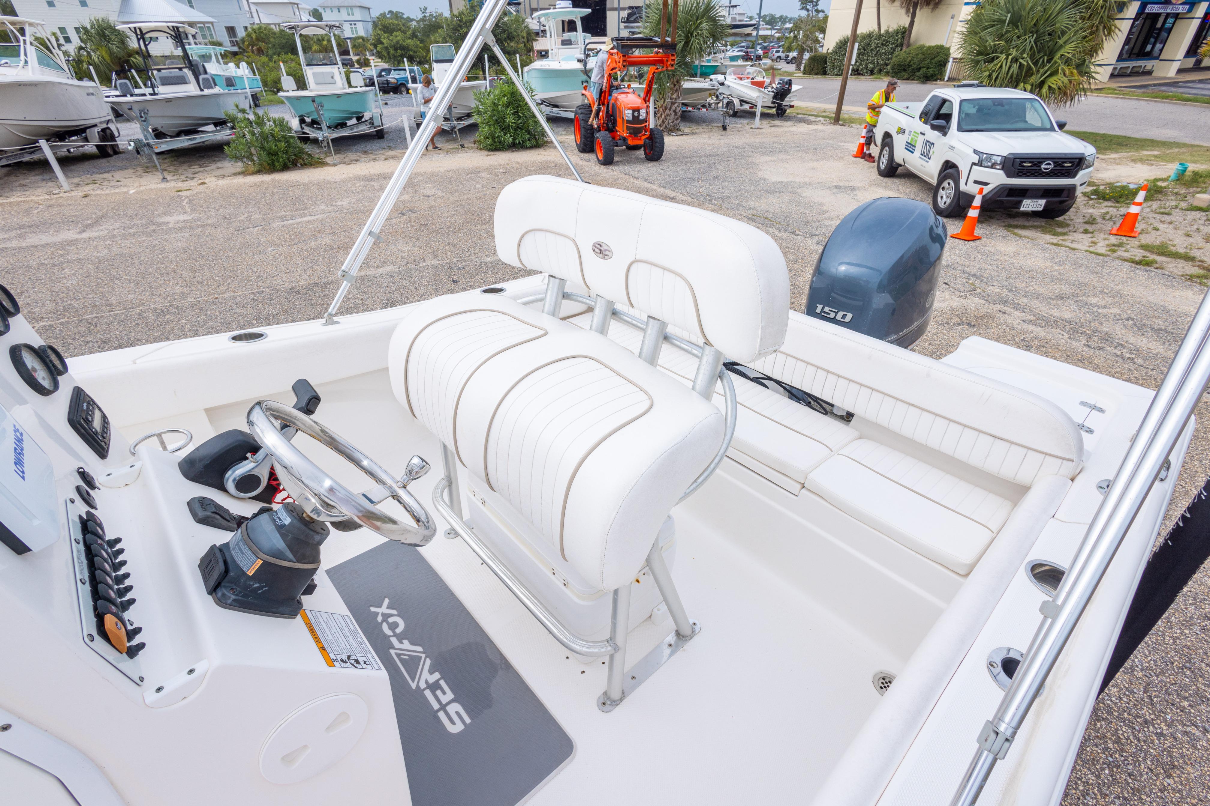 2014 Sea Fox 209 Commander boat interior with steering wheel and seating.