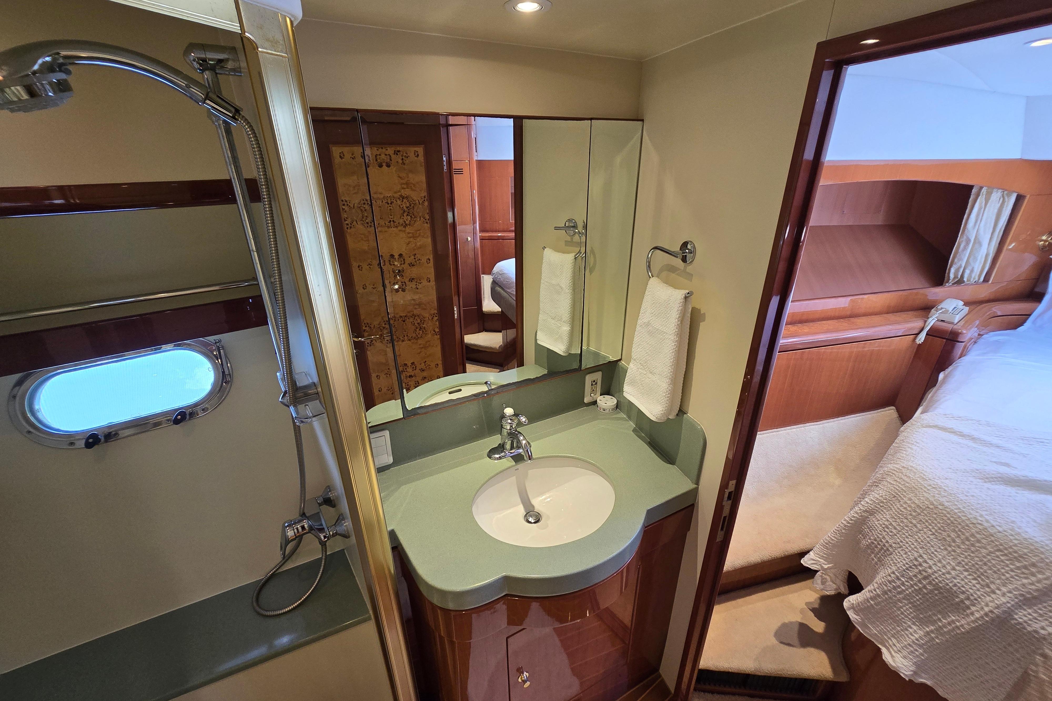 Luxurious bathroom interior of 2004 Grand Harbour 58 yacht, featuring modern fixtures and elegant design.