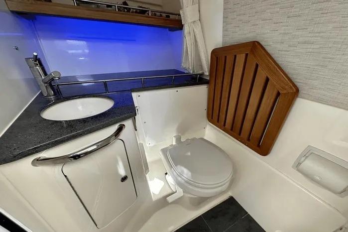 Luxurious 2019 Boston Whaler 350 Realm boat bathroom with modern amenities and sleek design.
