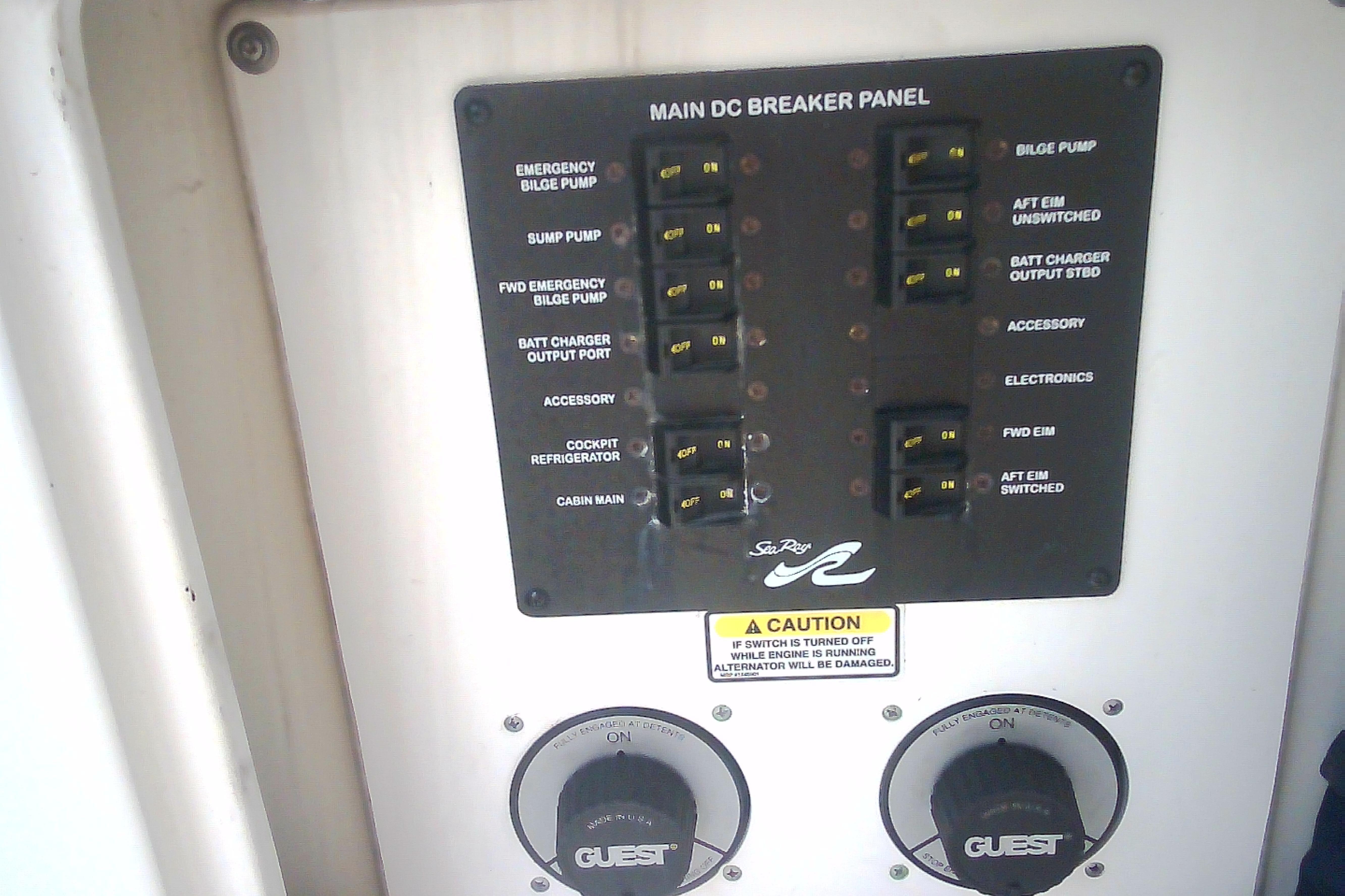 Main DC breaker panel on 2005 Sea Ray 300 Sundancer boat, featuring various switches and controls.