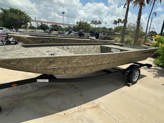 2025 Tracker Grizzly 1648 Jon boat on trailer, parked outdoors under a cloudy sky.