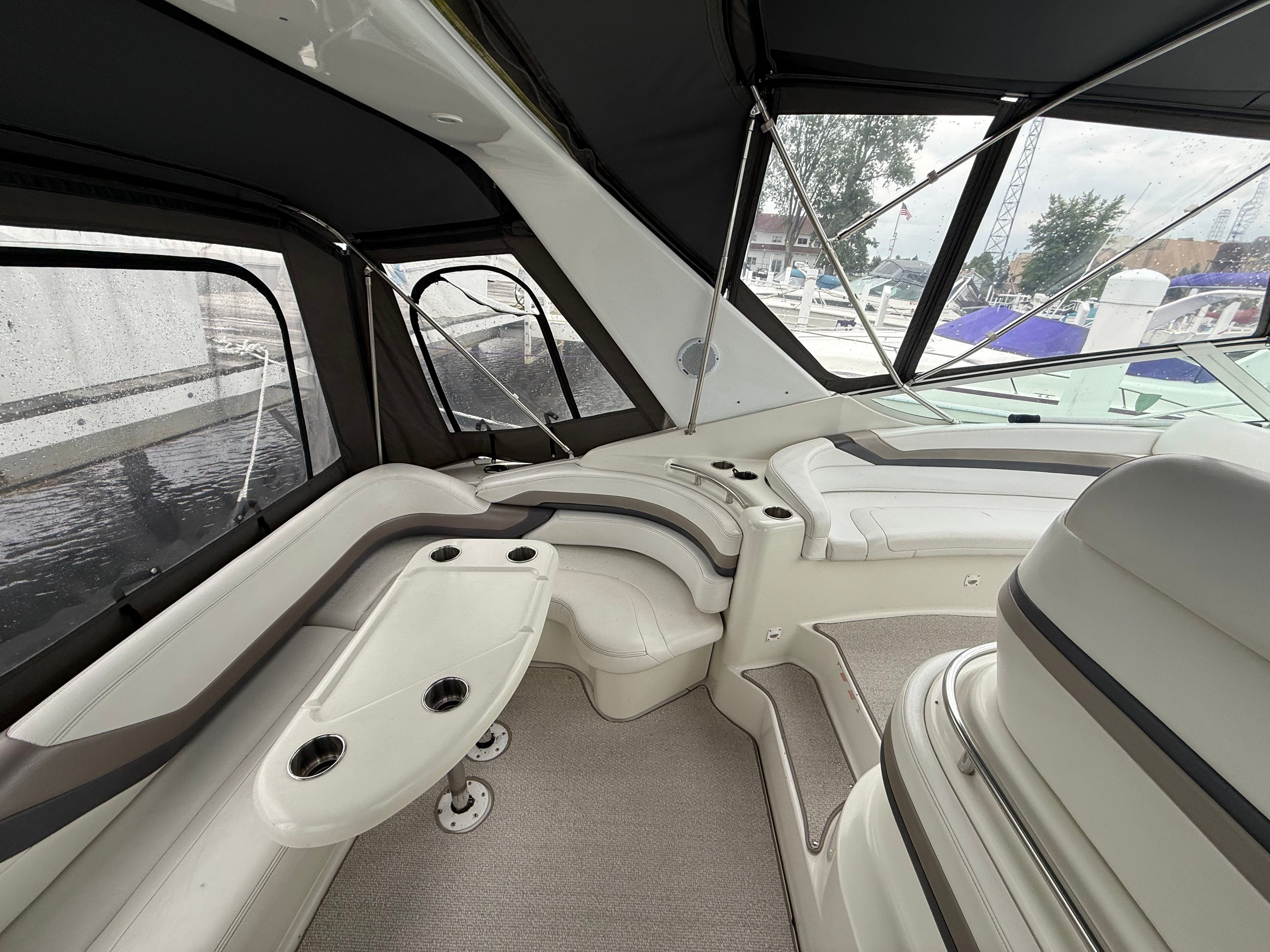 Interior of a 1995 Silverton 360 with sleek seating and panoramic windows.