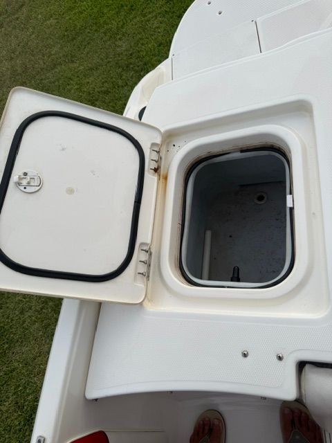 Open storage compartment on a 2012 Bayliner 184 SF boat.