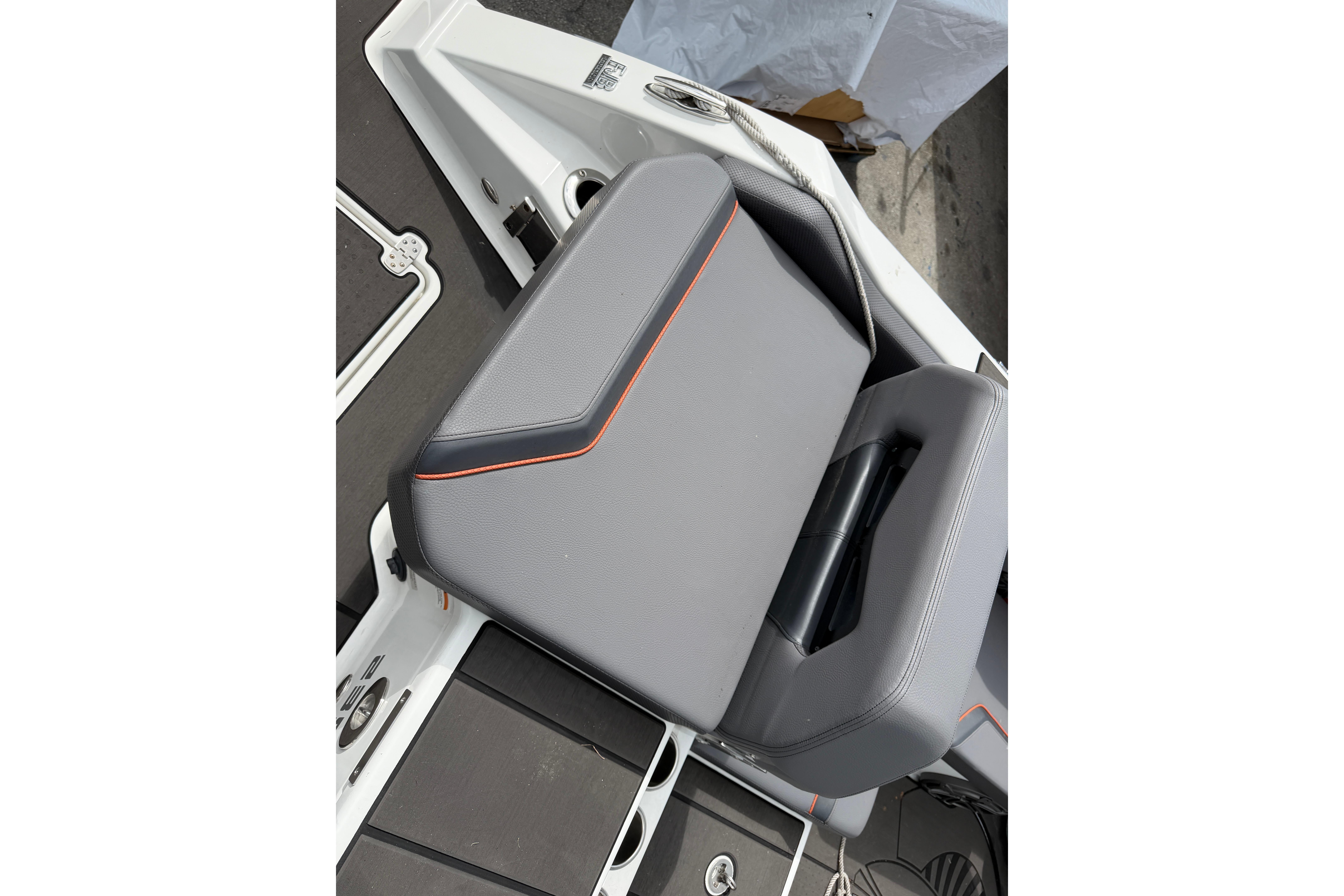 2026 Scarab 235 LX boat seat with sleek gray upholstery and orange accents.