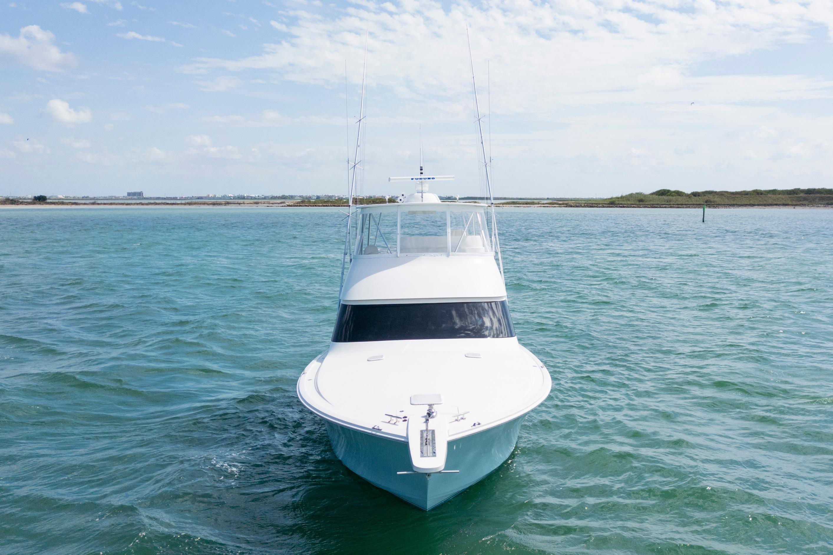 2009 Viking 50 Convertible yacht on open water, clear sky background.