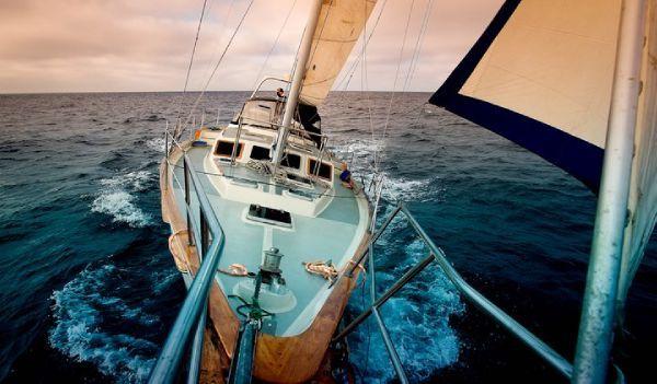 1984 Irwin Center Cockpit sailboat navigating open sea.
