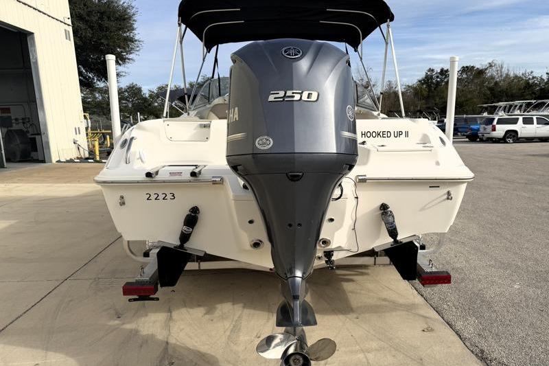 2022 Key West 239 DFS boat with Yamaha 250 engine, parked outdoors.