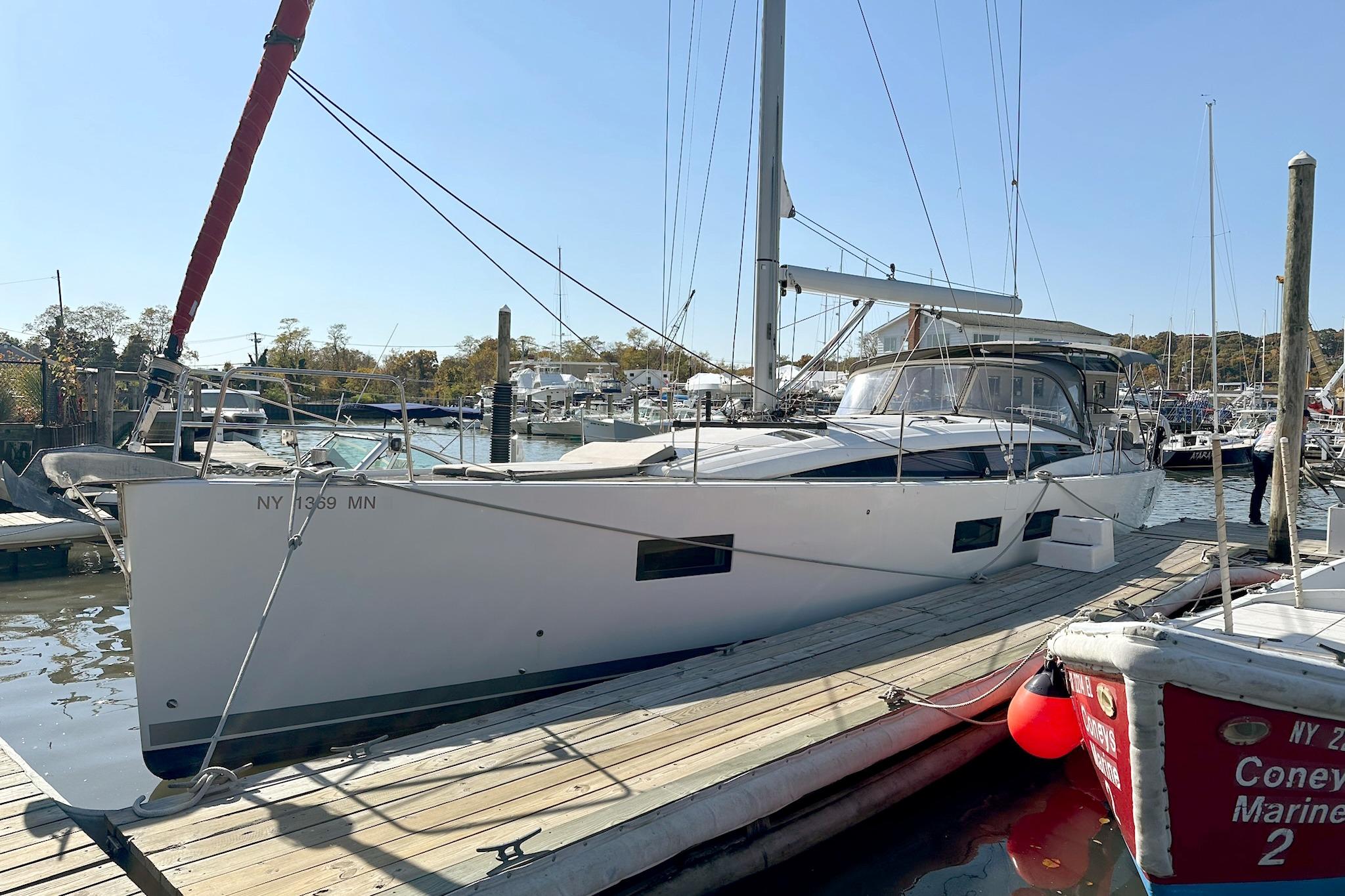 2018 Jeanneau 51 sailboat docked at marina, featuring sleek design and modern amenities.