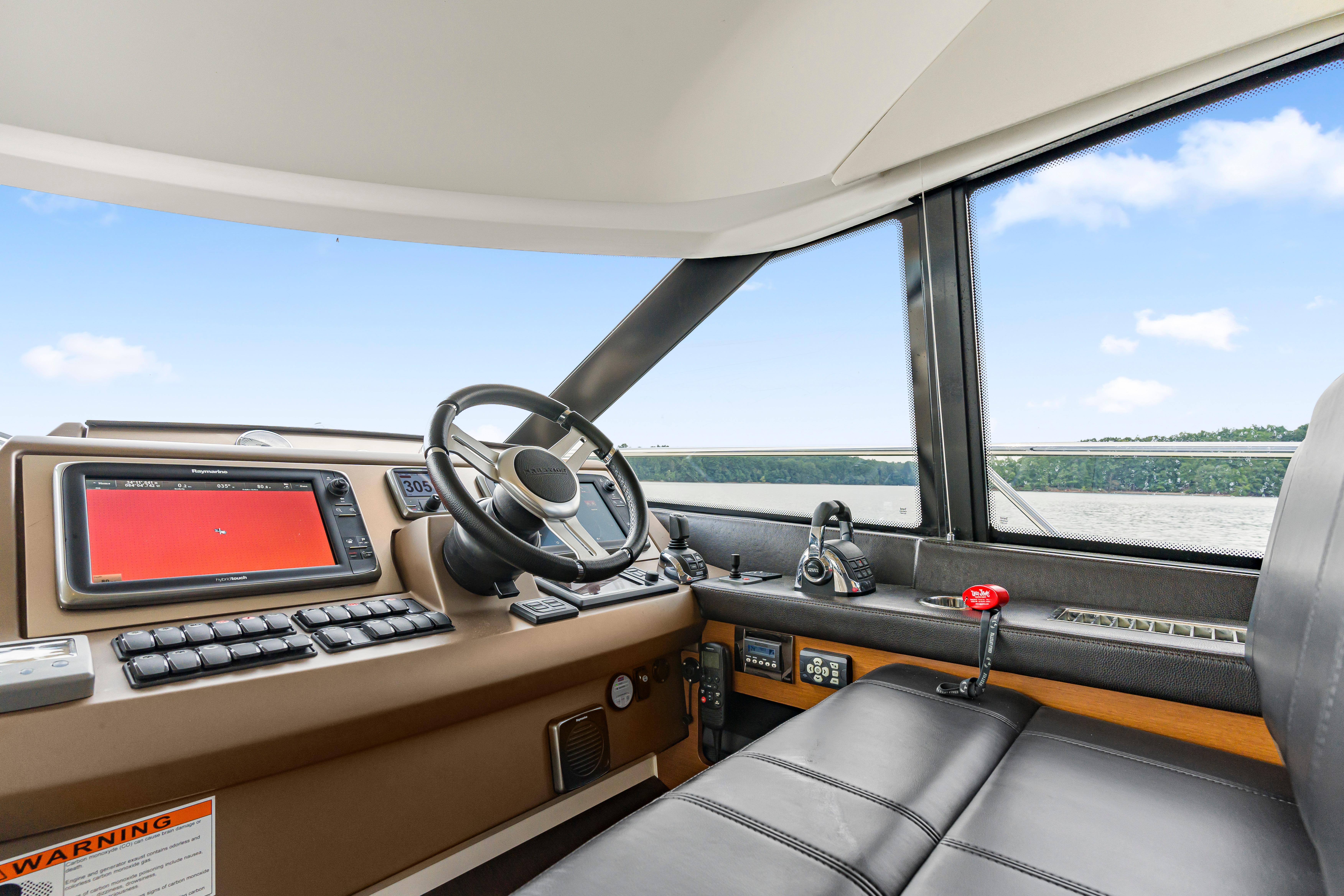 2017 Prestige 500 yacht helm with modern navigation controls and panoramic view.