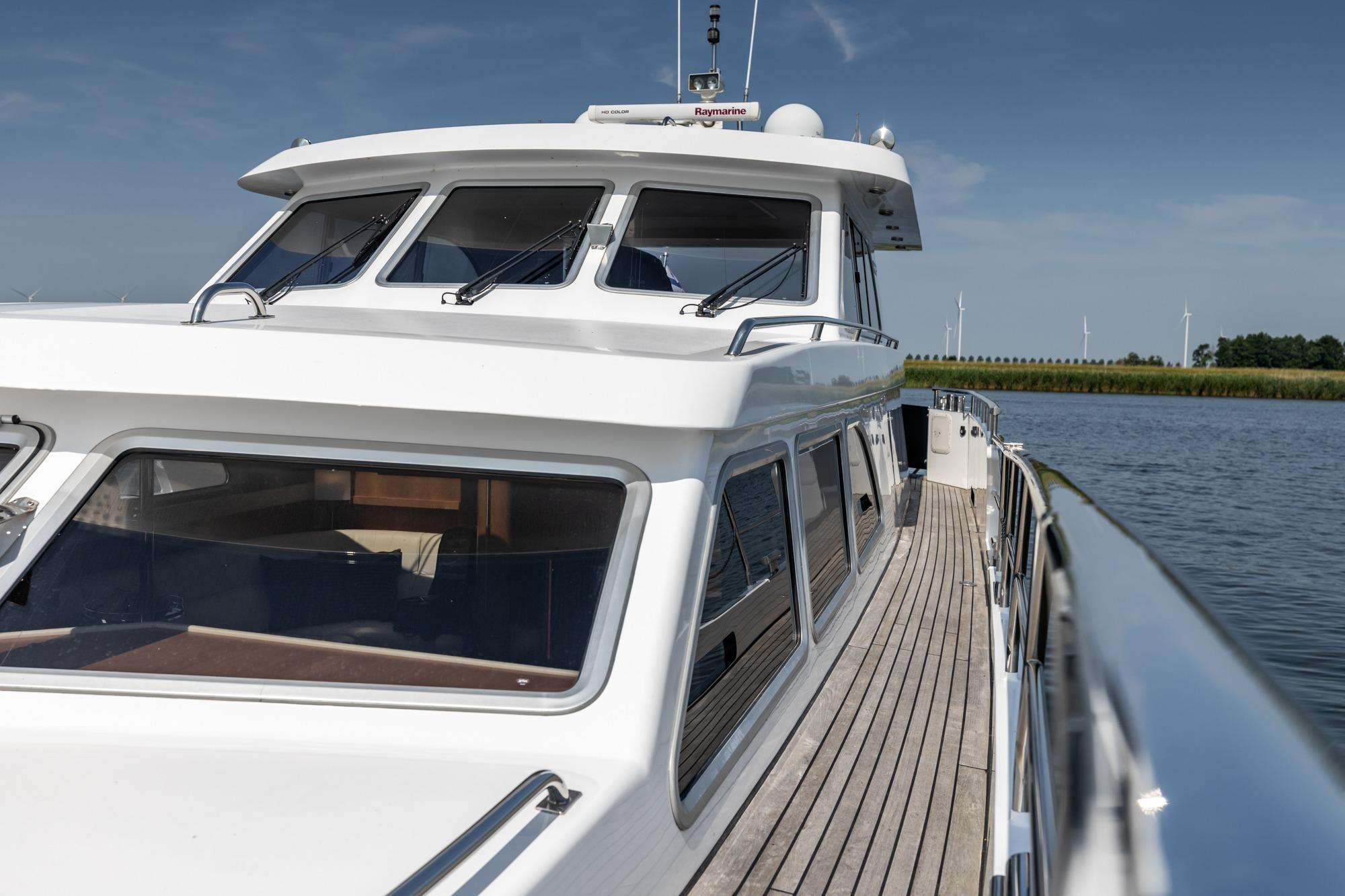 2005 Van der Valk Continental 1900 yacht on calm water, showcasing sleek design and spacious deck.