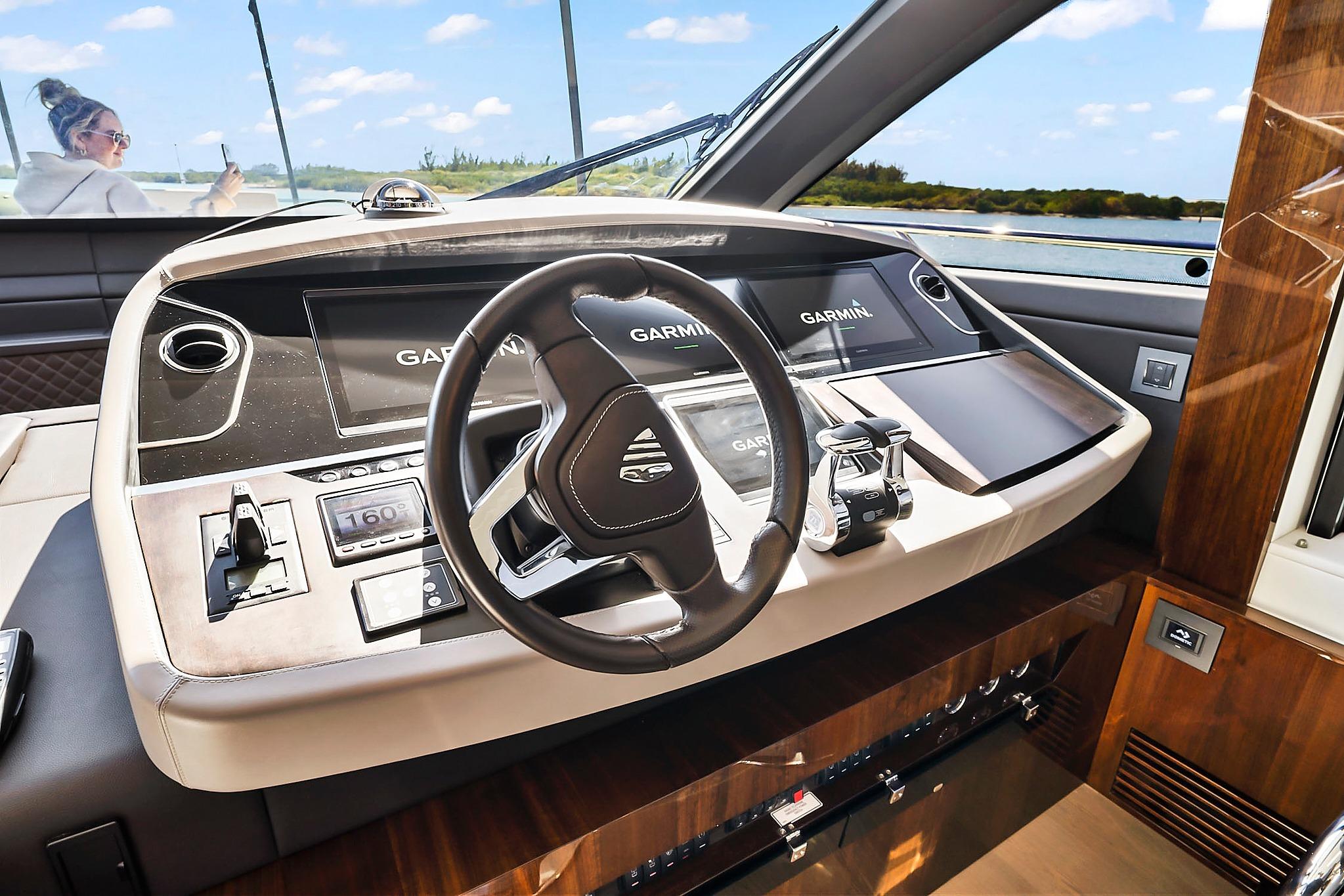 Helm of 2021 Fairline Squadron 68 yacht with Garmin navigation system.