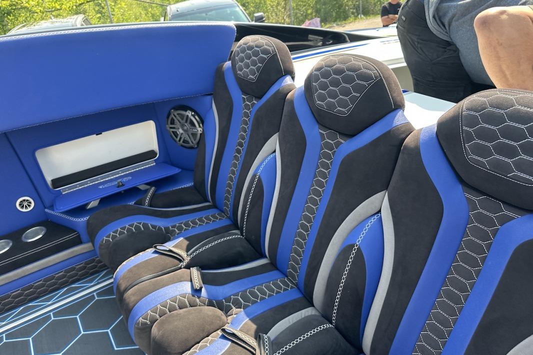 Luxurious blue and black interior of 2018 Wright Performance 420 boat with hexagonal patterns.