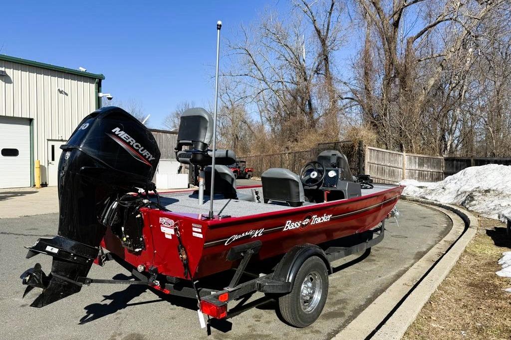 2026 Tracker Bass Tracker Classic XL boat with Mercury engine, parked outdoors.
