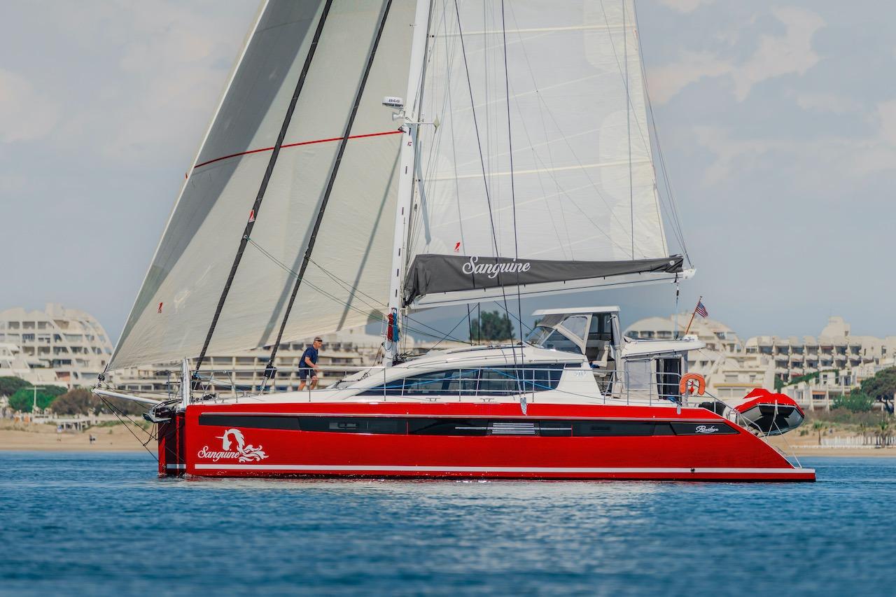 Red Privilege Signature 510 yacht sailing on calm waters, year 2025.