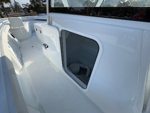 2025 Yellowfin 39 Offshore boat interior with seating and storage compartment.