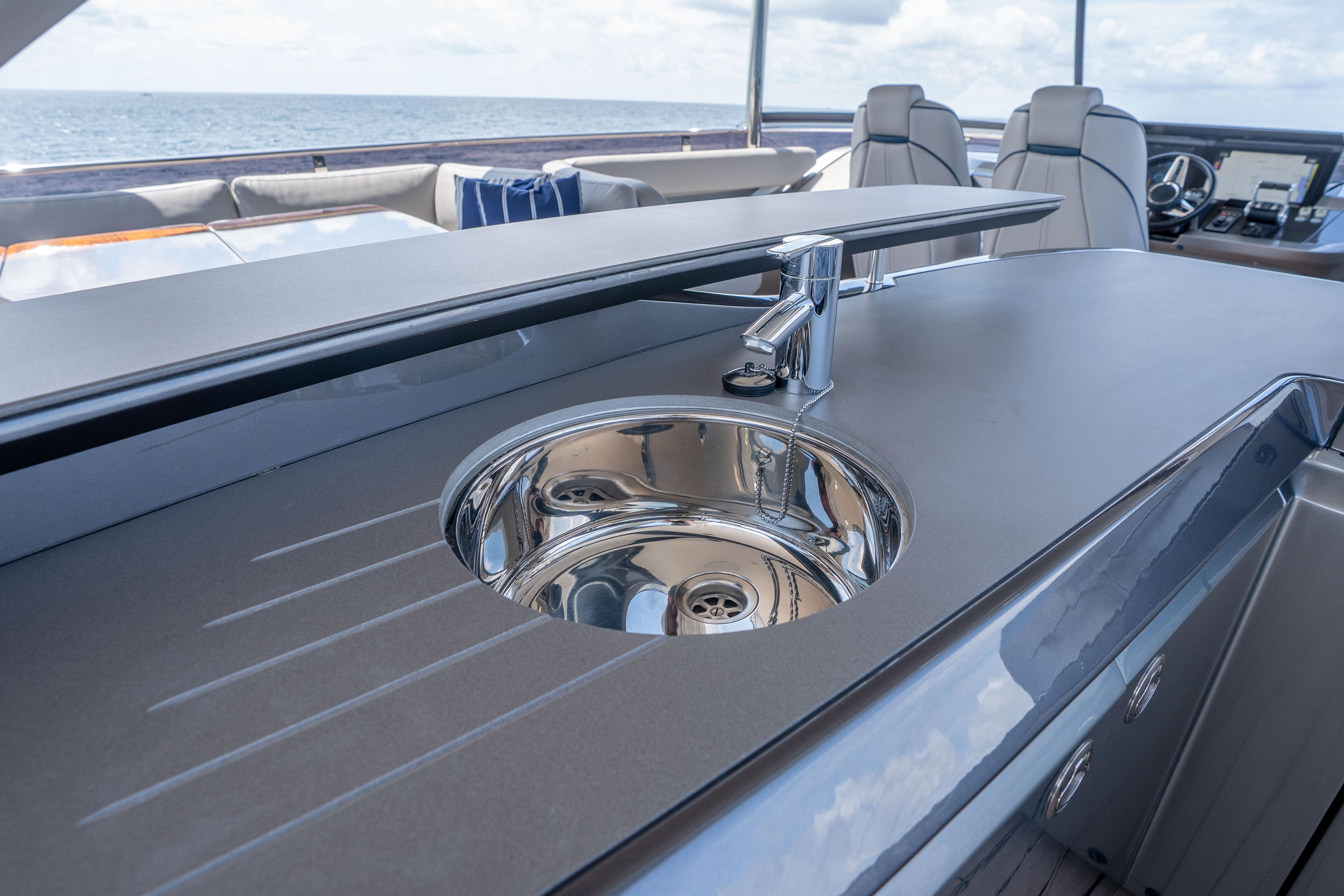 Luxury yacht Princess Y85 2020 with sleek outdoor sink and ocean view.