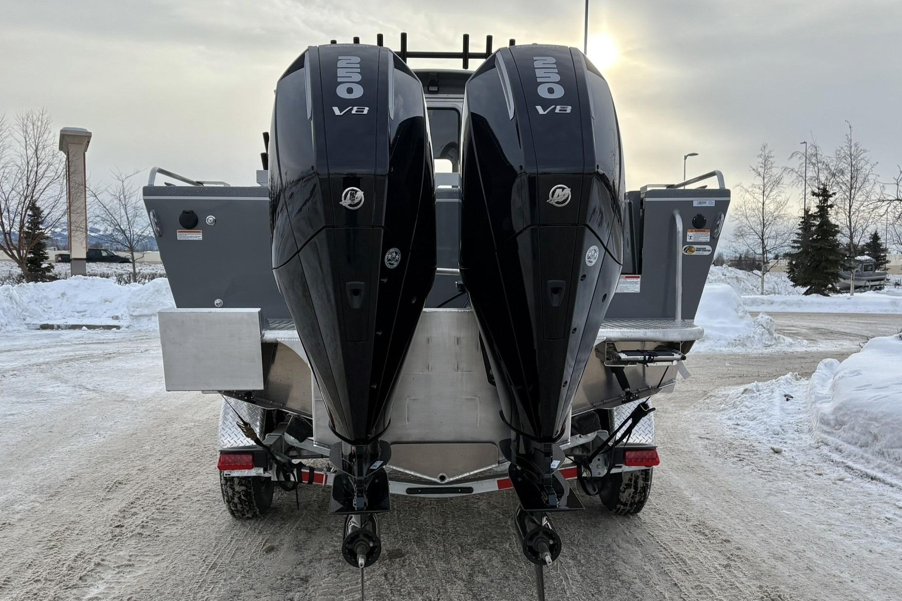 2024 Spartan 26 Maximus Pro XL boat with dual 250 V8 engines in snowy setting.