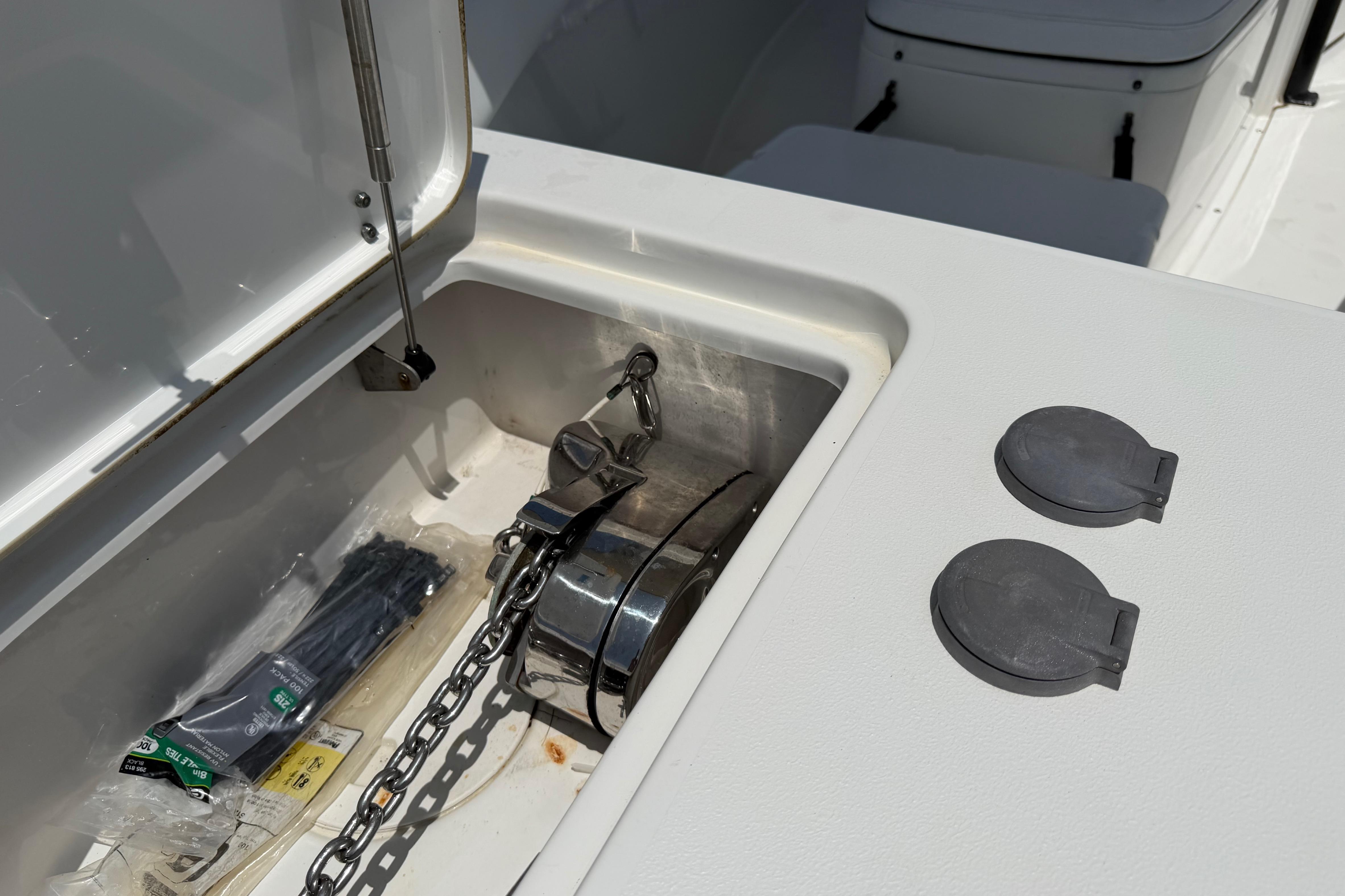 2019 Sea Hunt Gamefish 27 Coffin Box with anchor storage and accessories.