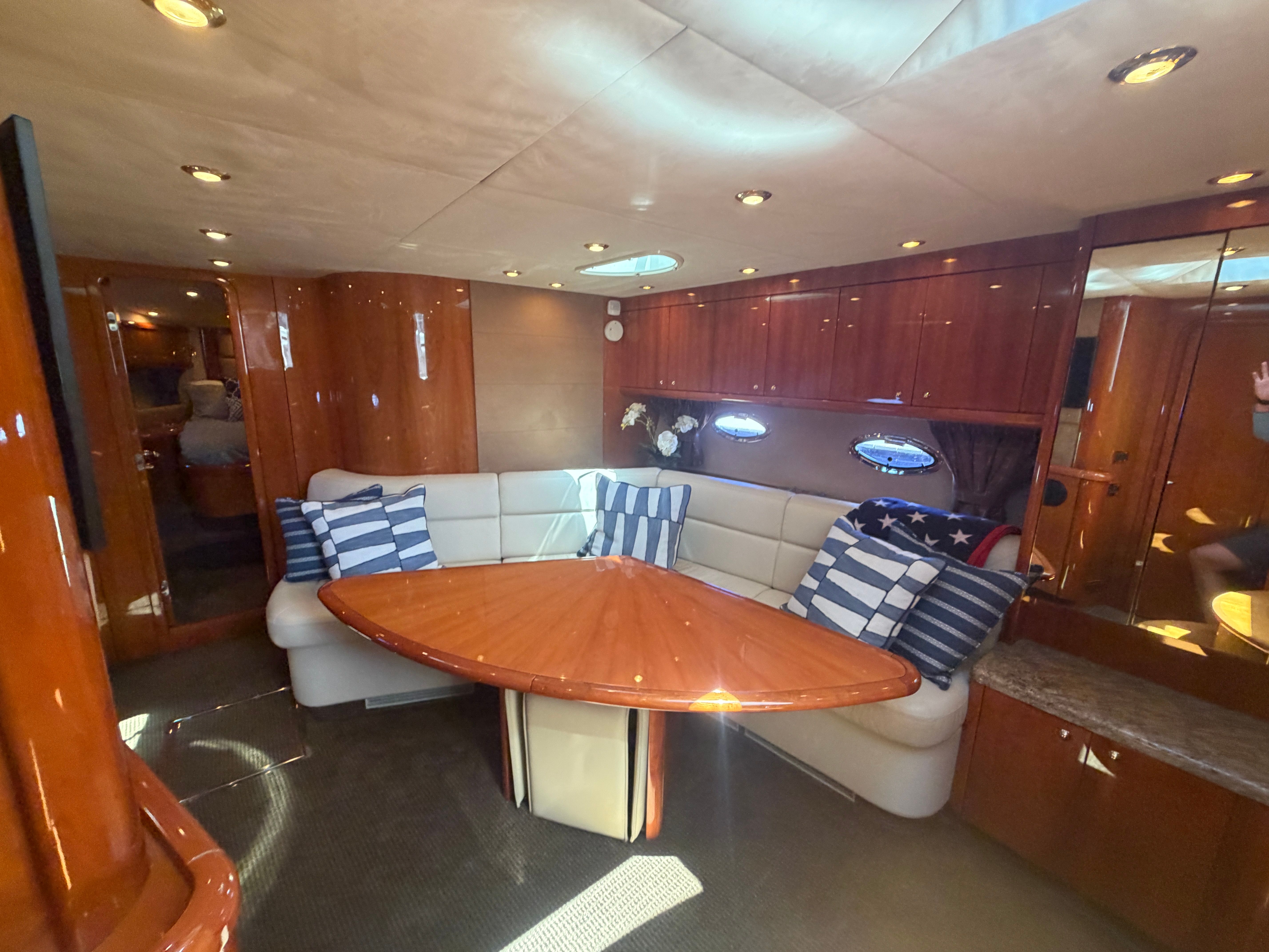 Interior of Sunseeker Portofino 53 with elegant seating area and wooden table.