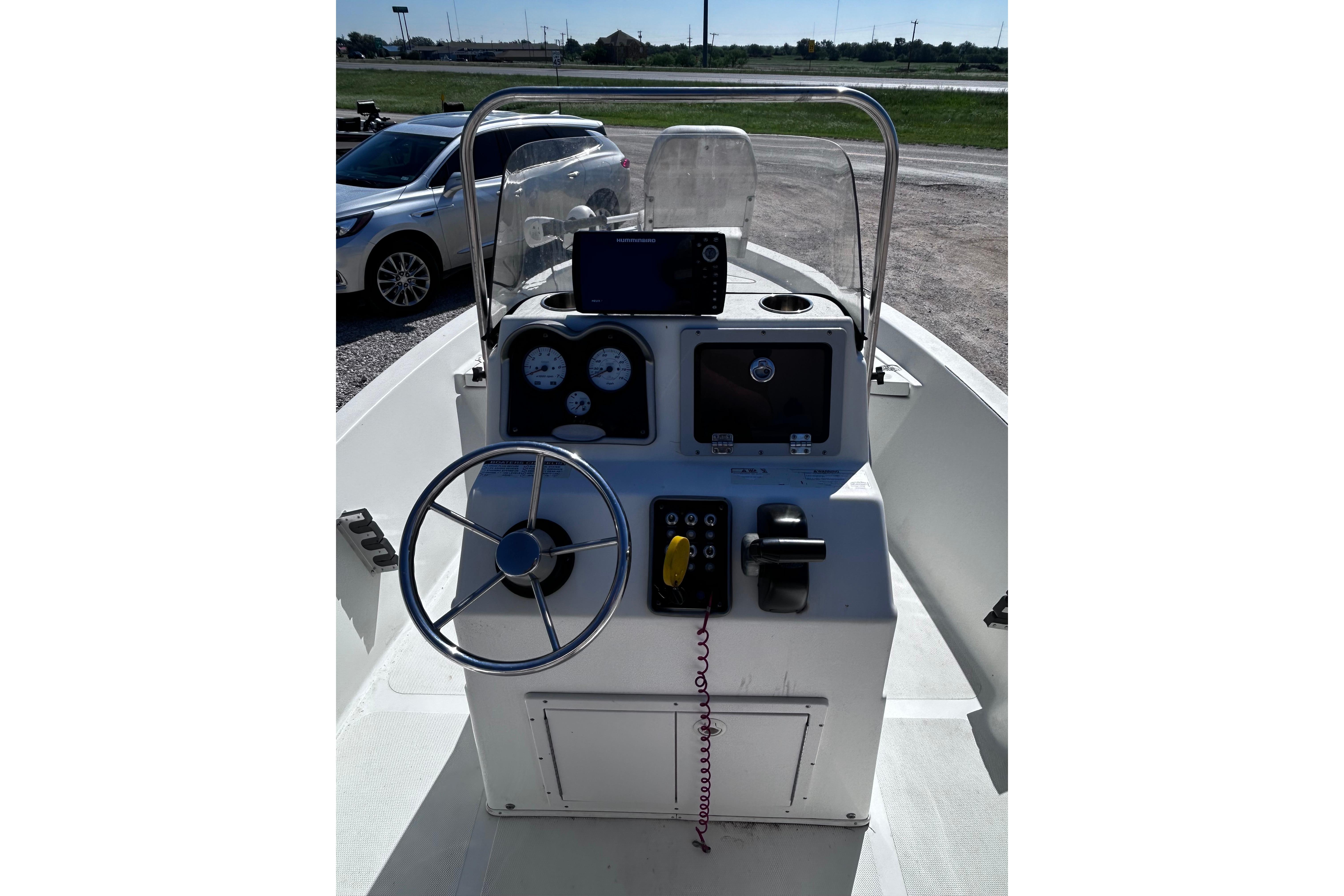 2016 NauticStar 1810 NauticBay boat console with steering wheel and gauges.