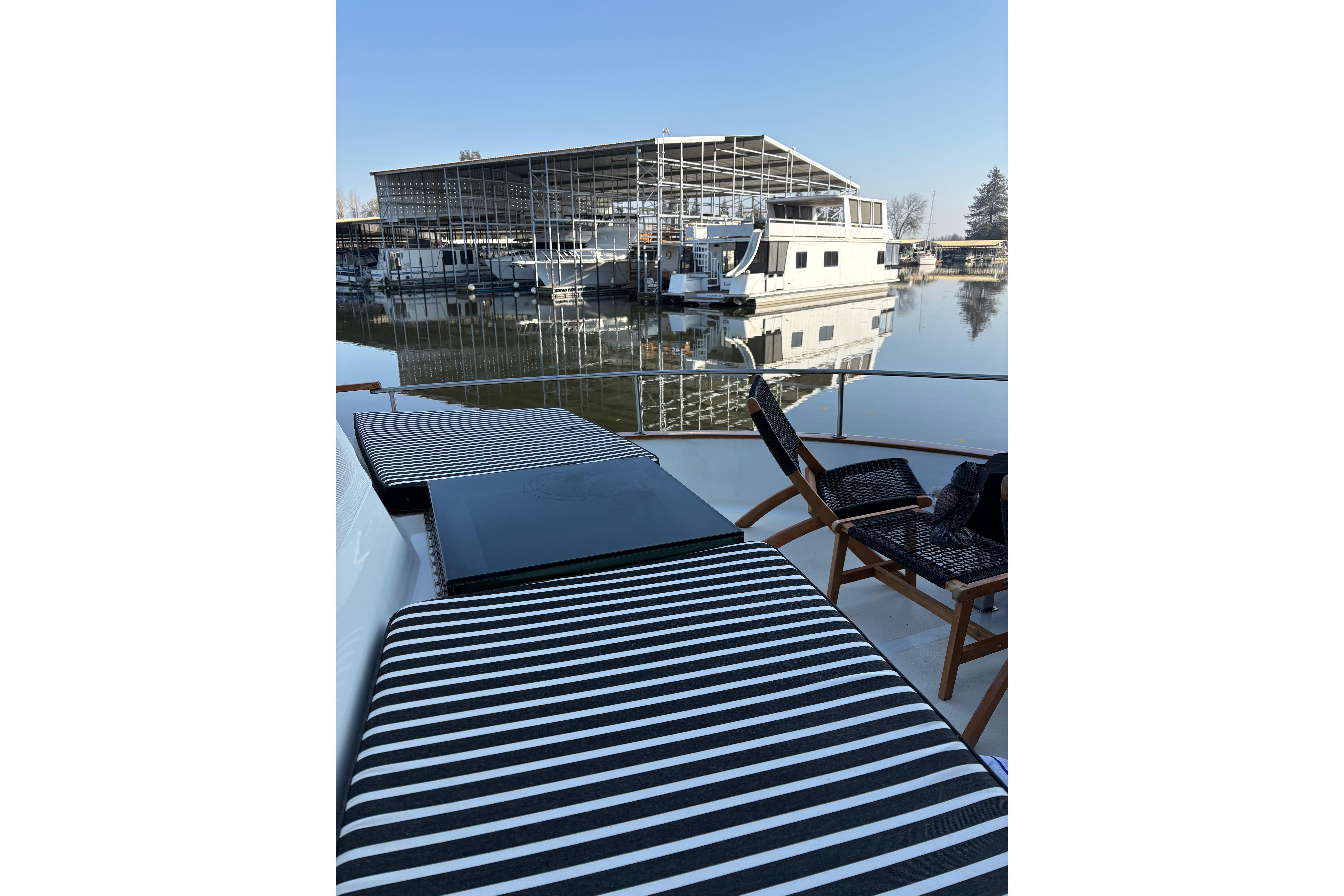 1978 Californian 42 LRC yacht with striped seating, docked near a marina.