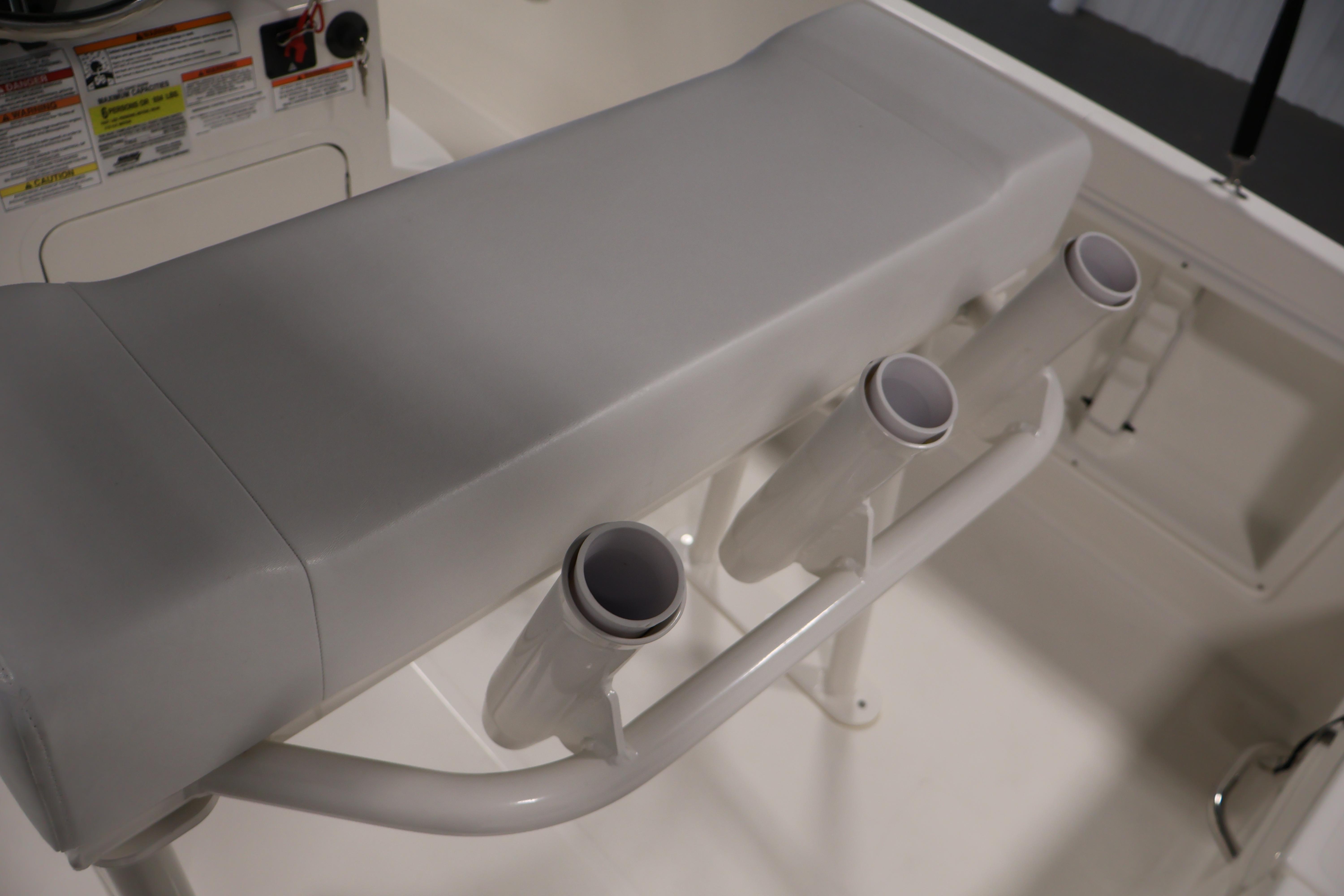 2026 Bayliner Trophy T18 boat seat with integrated rod holders.