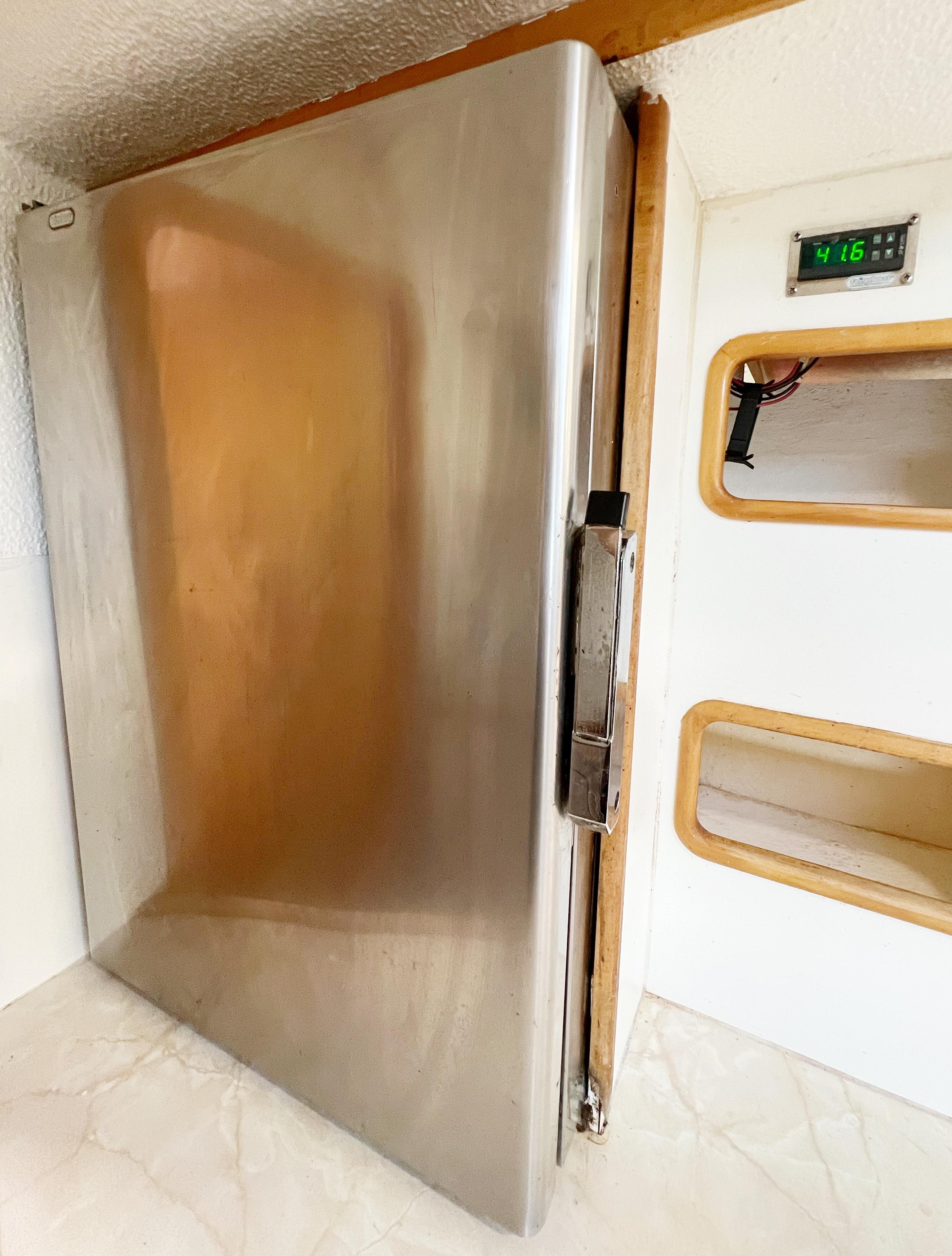 Stainless steel refrigerator in 1999 St Francis 44 MKII yacht interior.