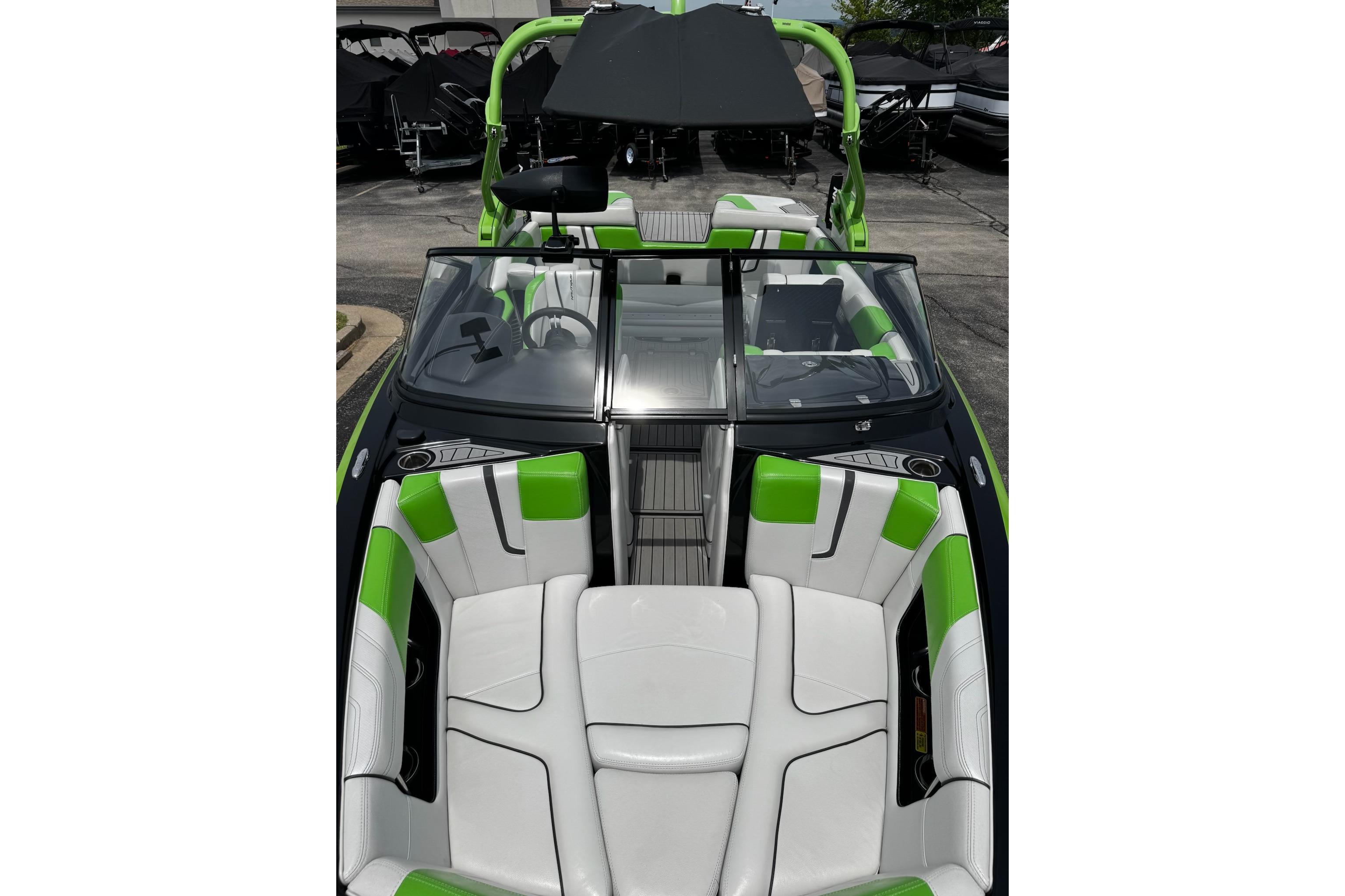 2014 Nautique Super Air Nautique G21 boat interior with green and white seating.