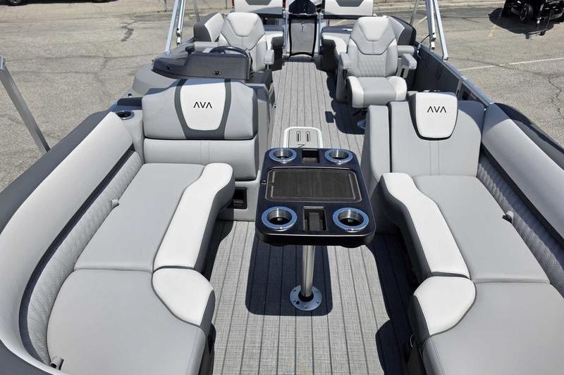 Luxurious 2026 Avalon Catalina Quad Lounge boat interior with plush seating and table.