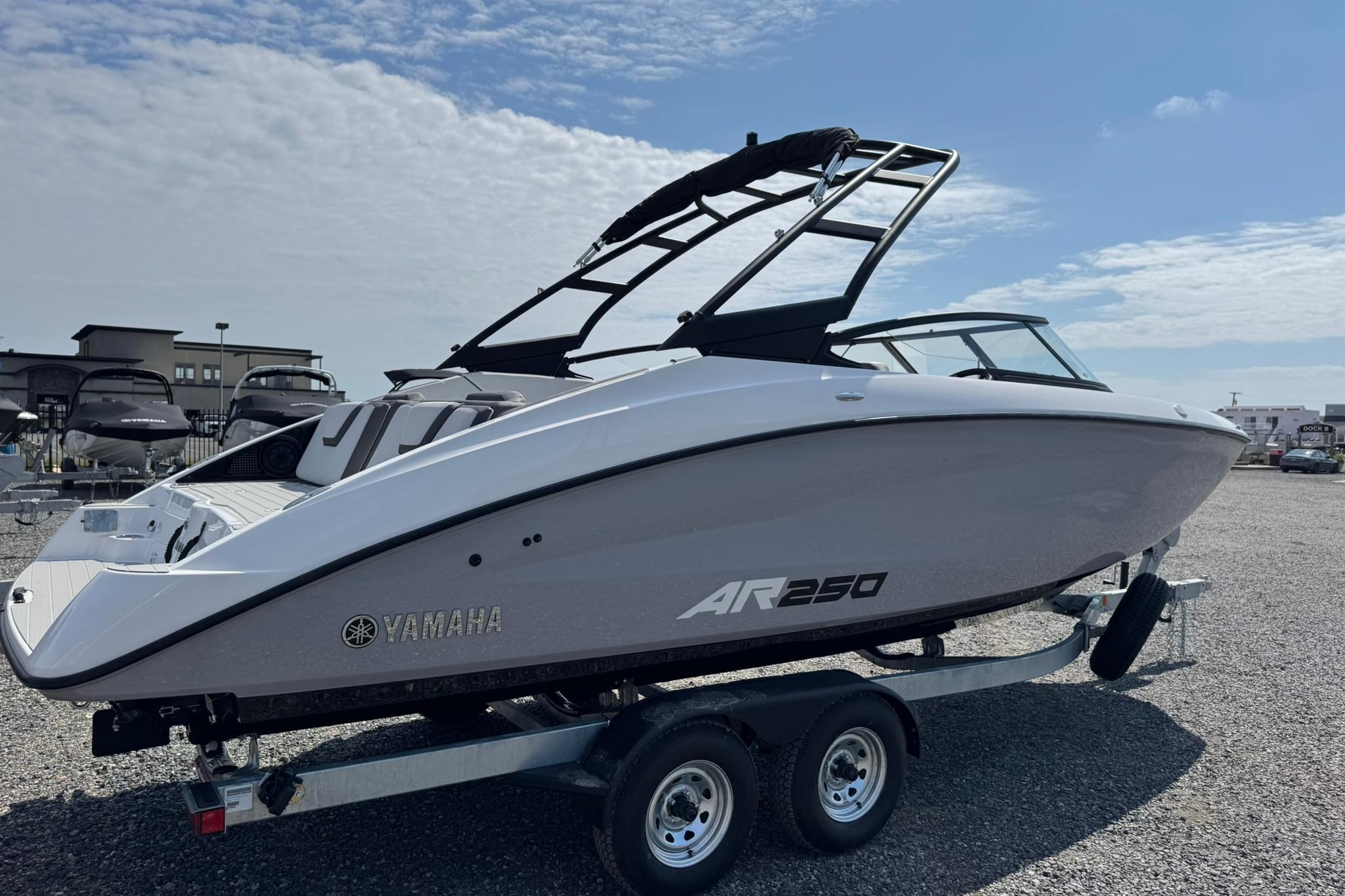 2026 Yamaha Boats AR250 on trailer under clear sky.