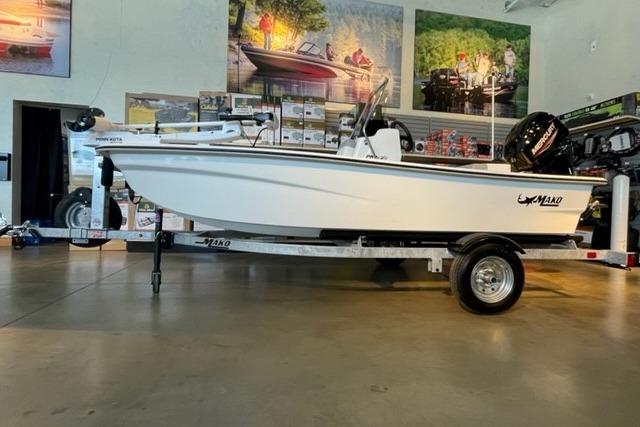 2026 Mako Pro Skiff 13 CC boat on trailer in showroom.