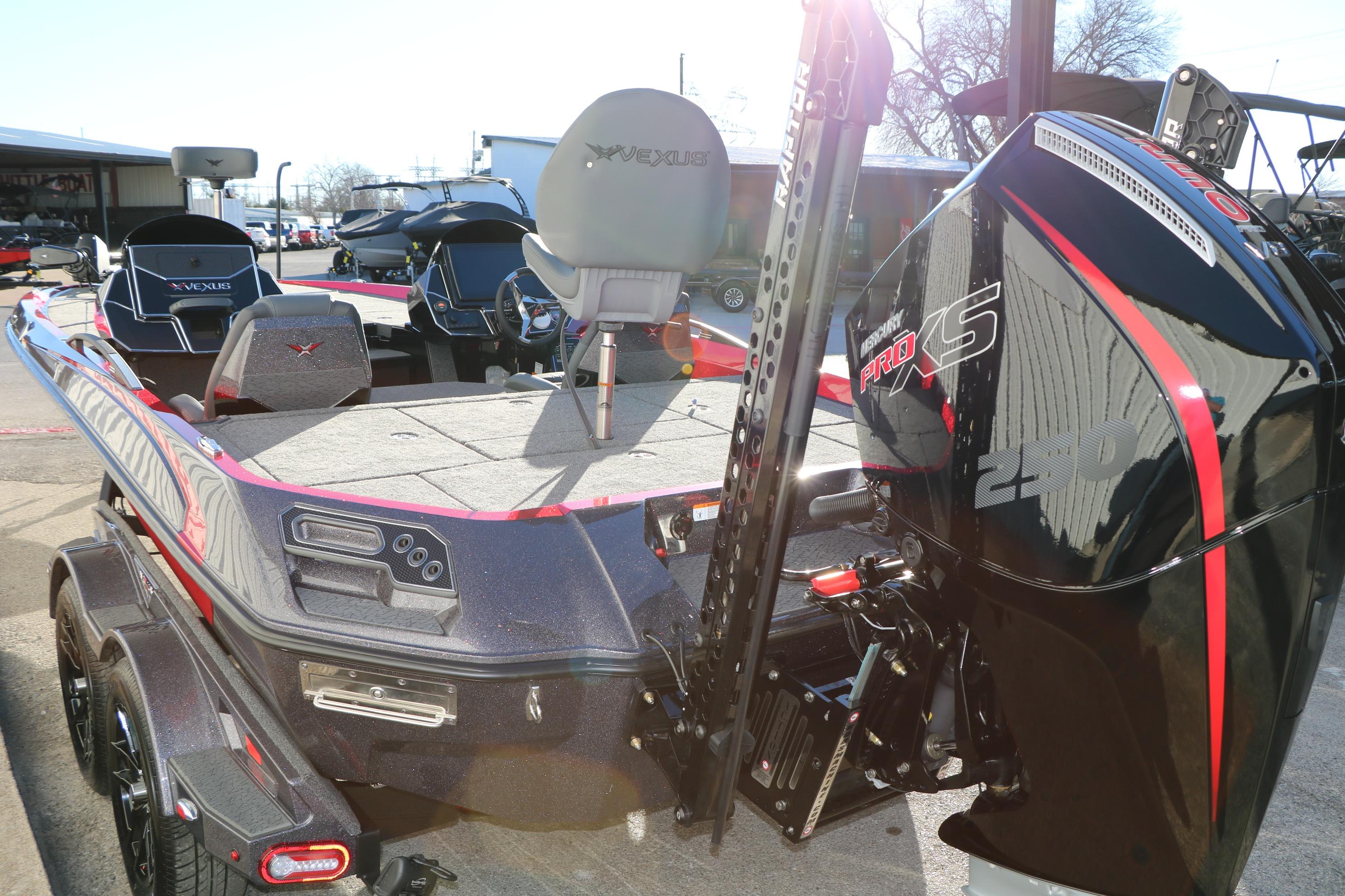 2026 Vexus VXs21 boat with Mercury Pro XS engine, parked outdoors.