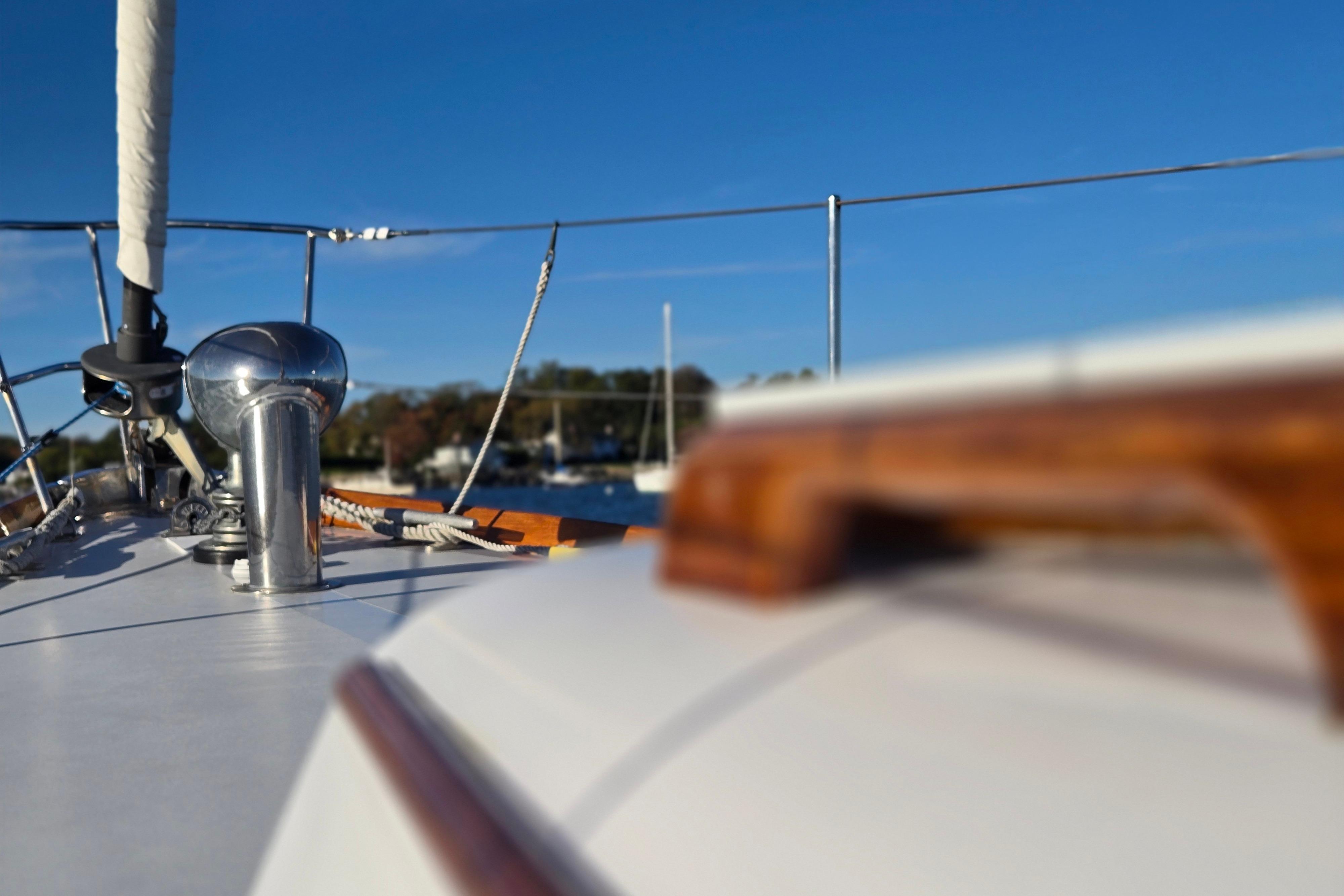 Close-up of 1970 Hinckley Bermuda 40 sailboat deck with clear blue sky.