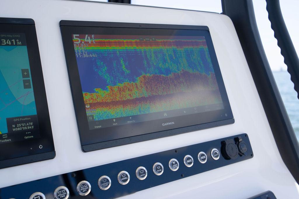 Garmin marine display on Reef Runner 340, 2027 model, showing sonar and GPS data.