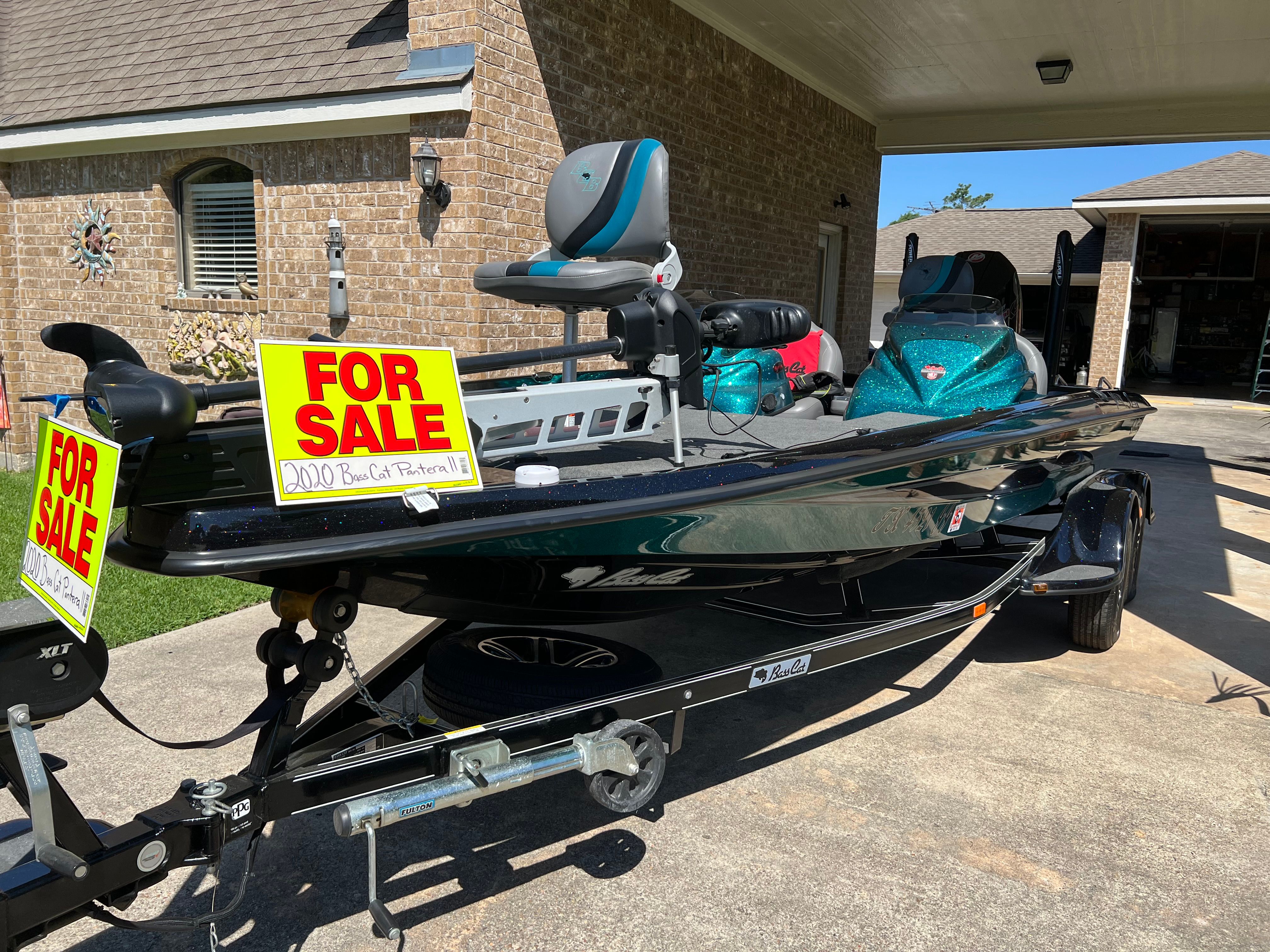 2020 Bass Cat Pantera II for sale, parked on a trailer in a driveway.