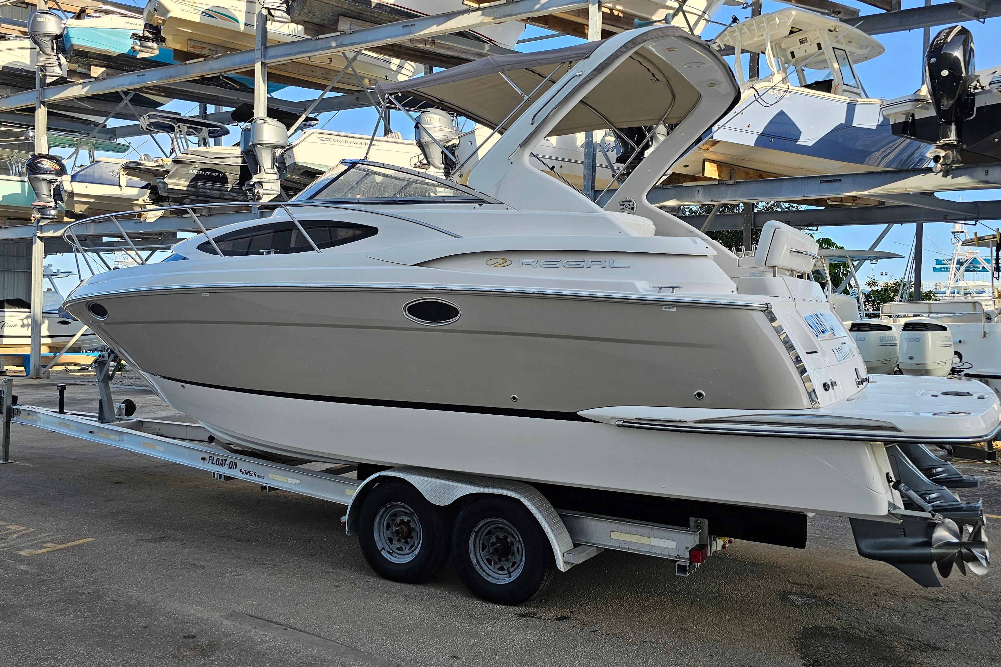 2005 Regal 3060 Window Express boat on trailer in storage facility.