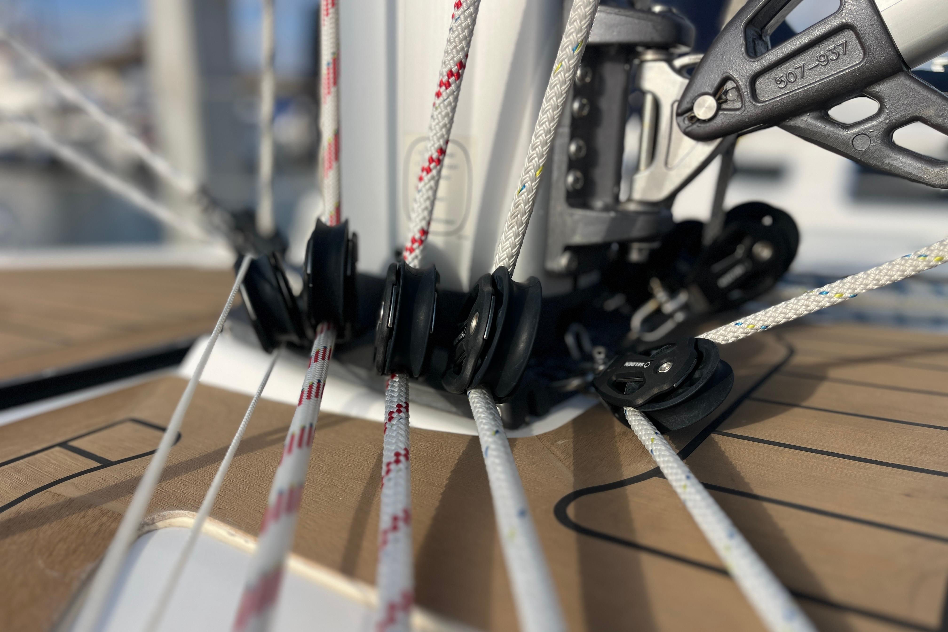 Close-up of Hanse 360 sailboat rigging, showcasing ropes and pulleys, 2025 model.