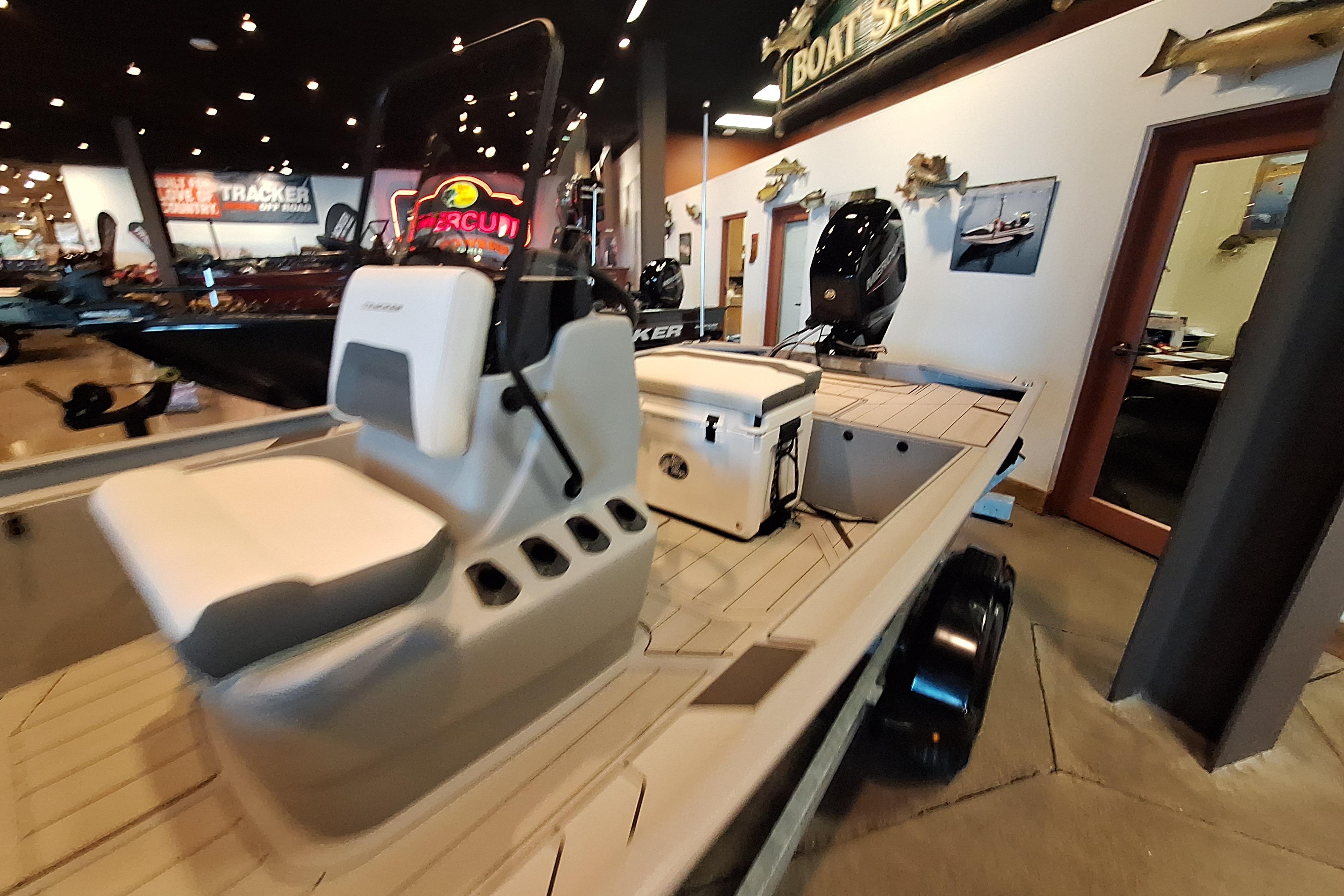 2026 Tracker Bass Tracker Classic CC boat displayed in showroom with modern interior design.