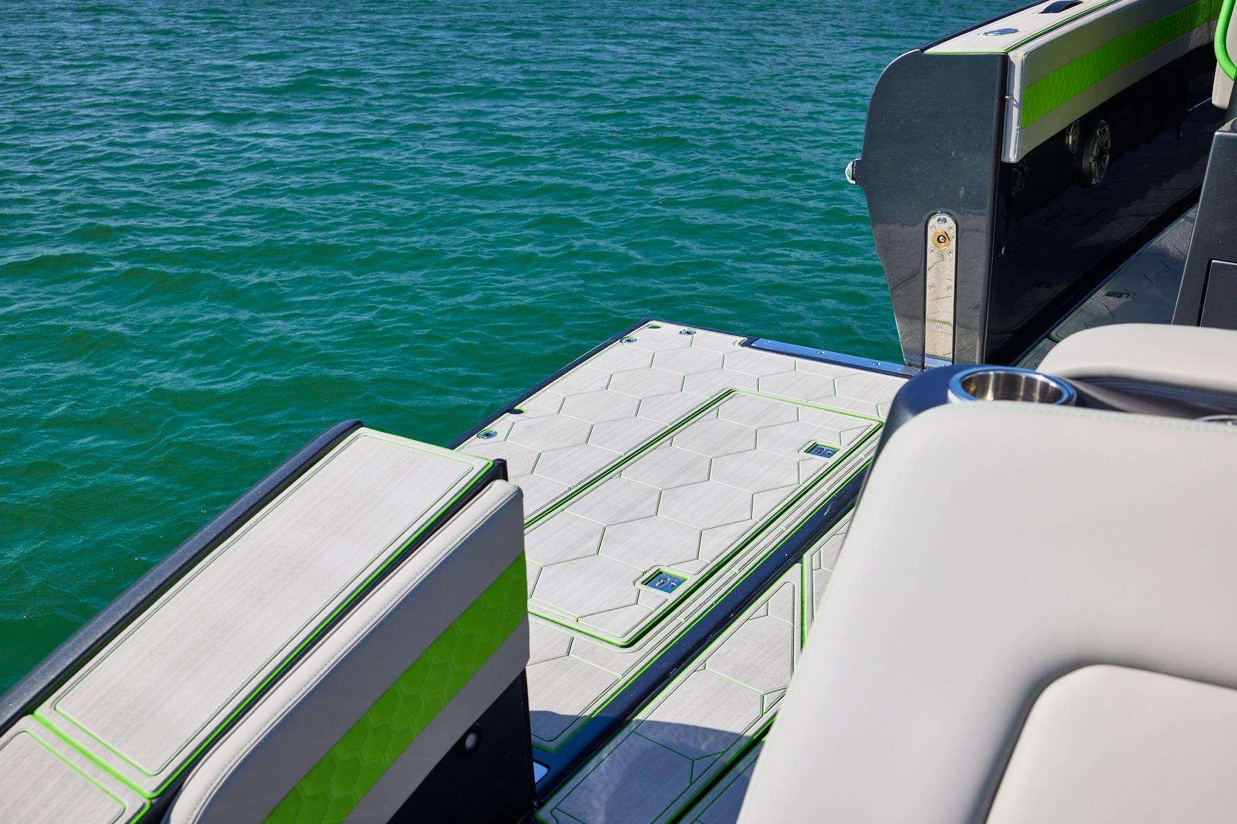 Luxury deck of Midnight Express 52' Vitesse yacht with sleek design and vibrant accents.