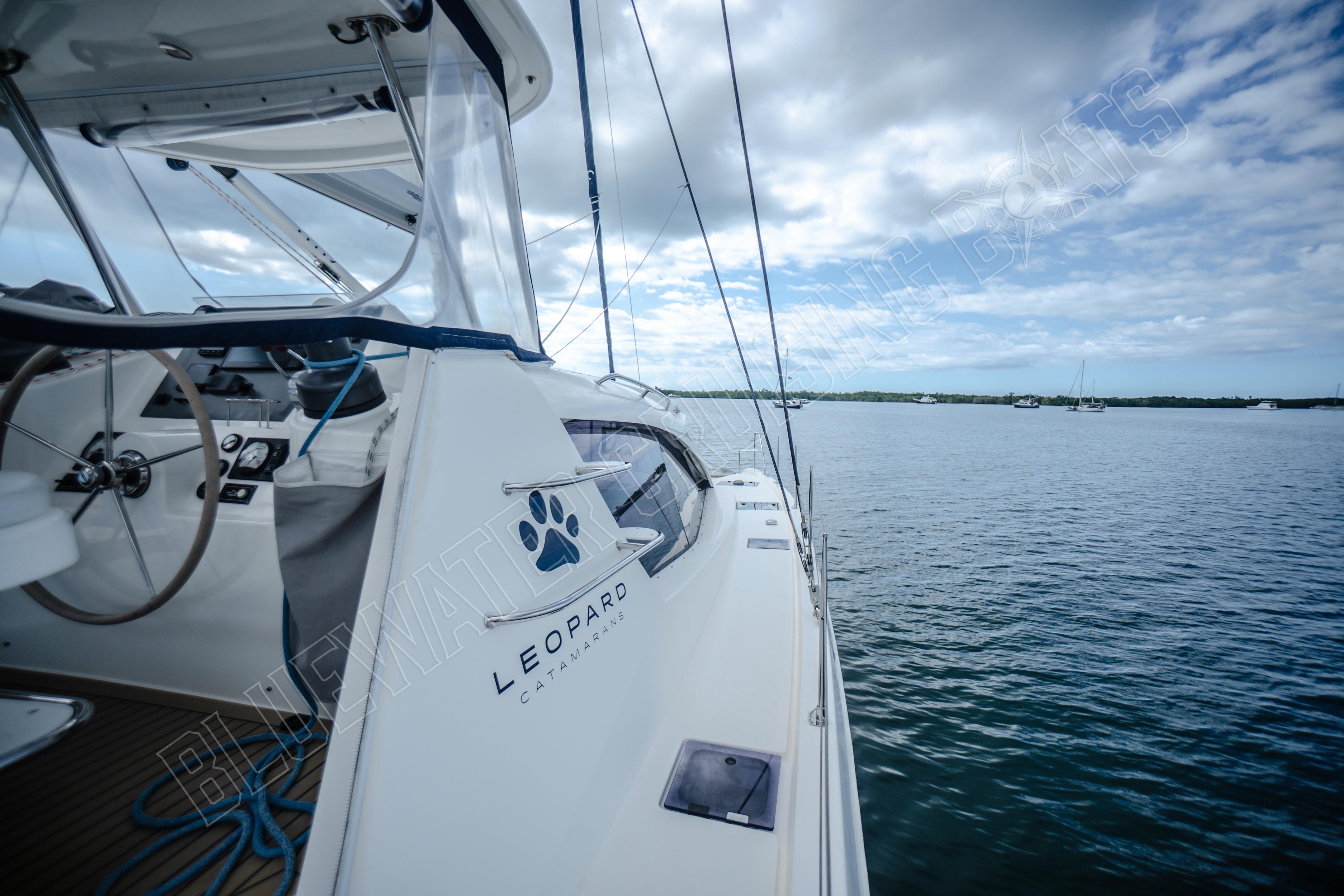 2015 Leopard 48 catamaran sailing on calm waters under a cloudy sky.