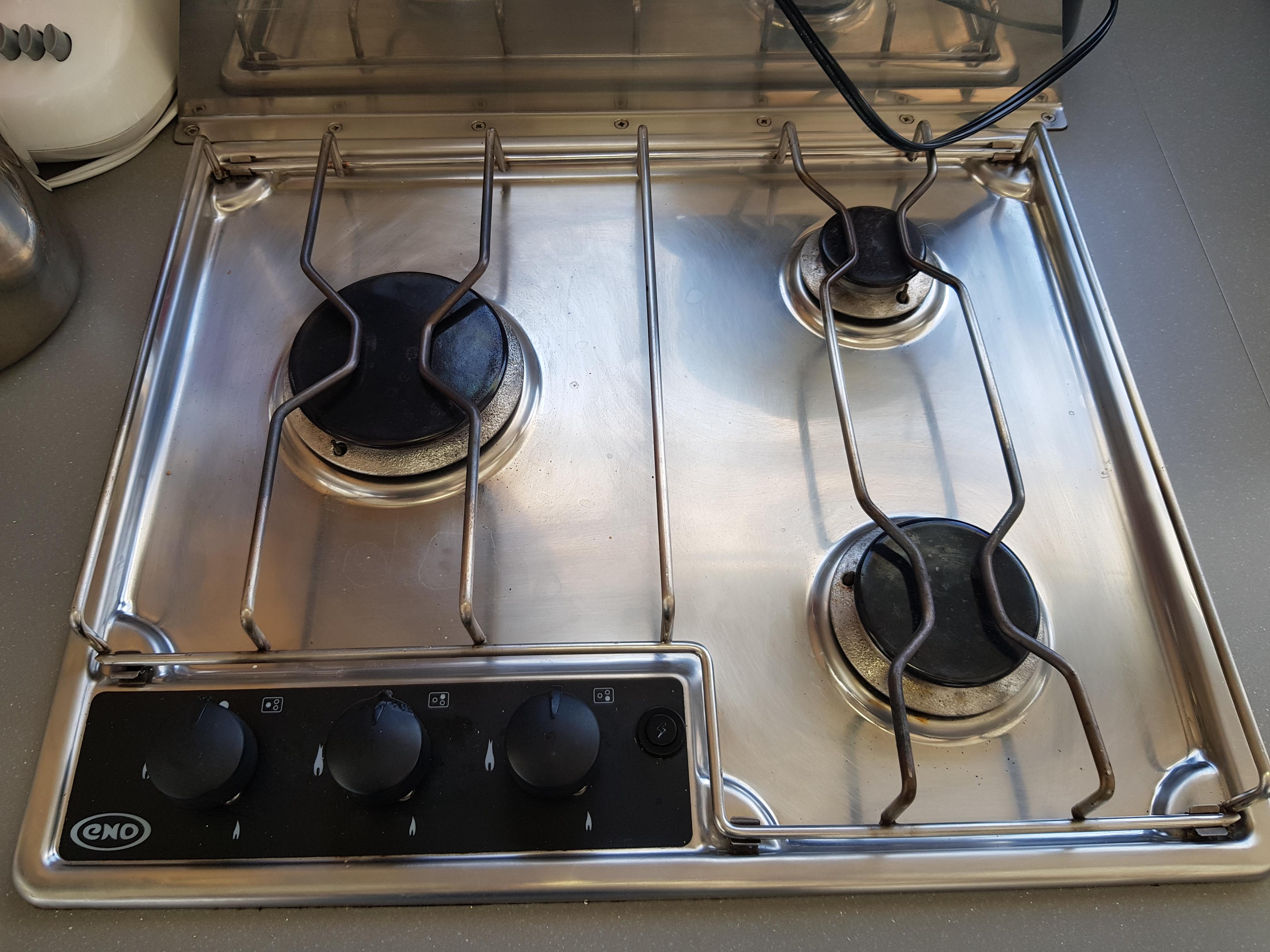 Stainless steel stove with three burners on a 2016 Fountaine Pajot Helia 44 yacht.