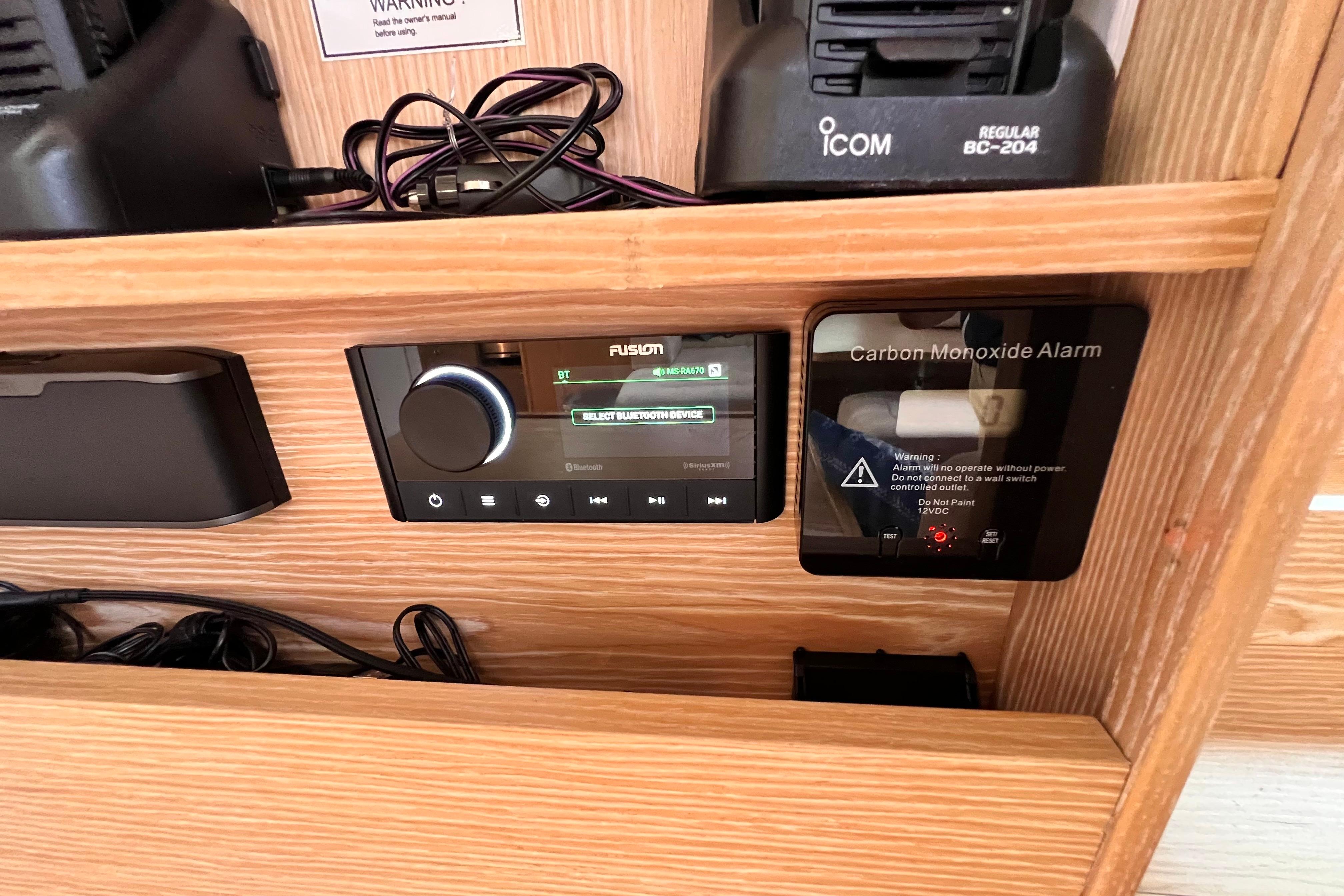 Control panel with Fusion stereo and carbon monoxide alarm on a 2016 Hanse 455 yacht.