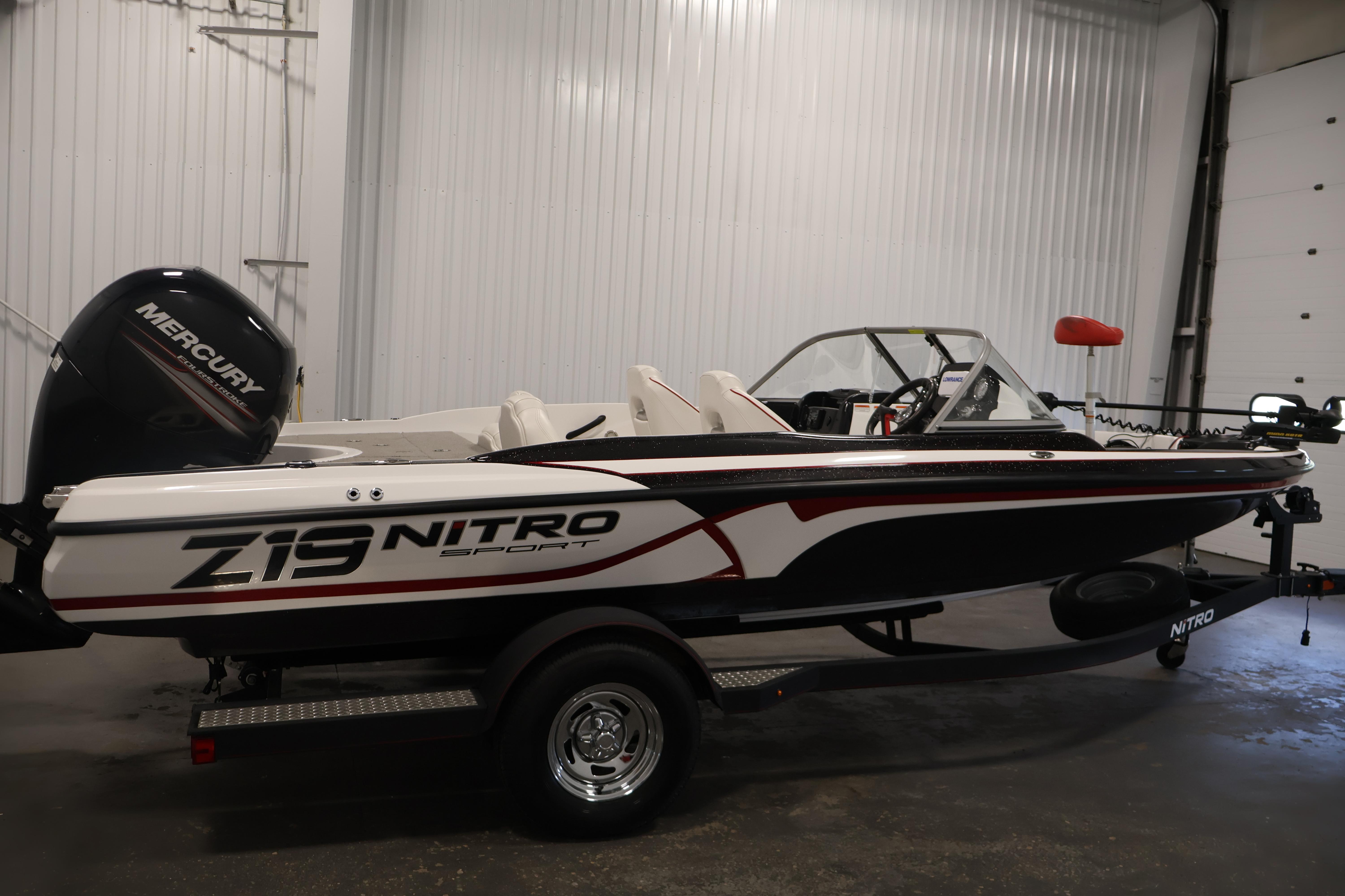 2019 Nitro Z19 Sport boat with Mercury engine in a garage setting.