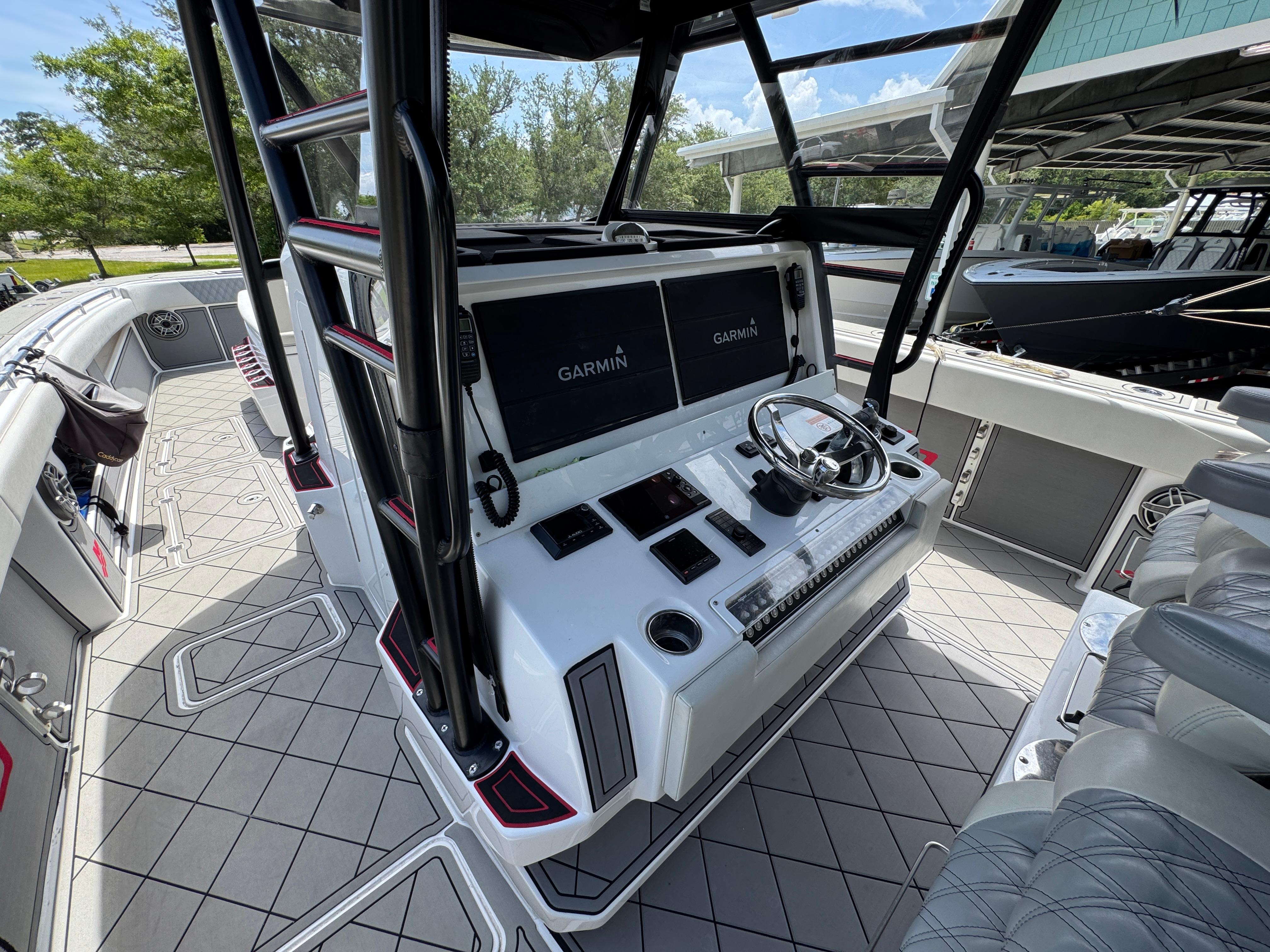 2020 Invincible 40 Catamaran helm with Garmin displays and modern controls.