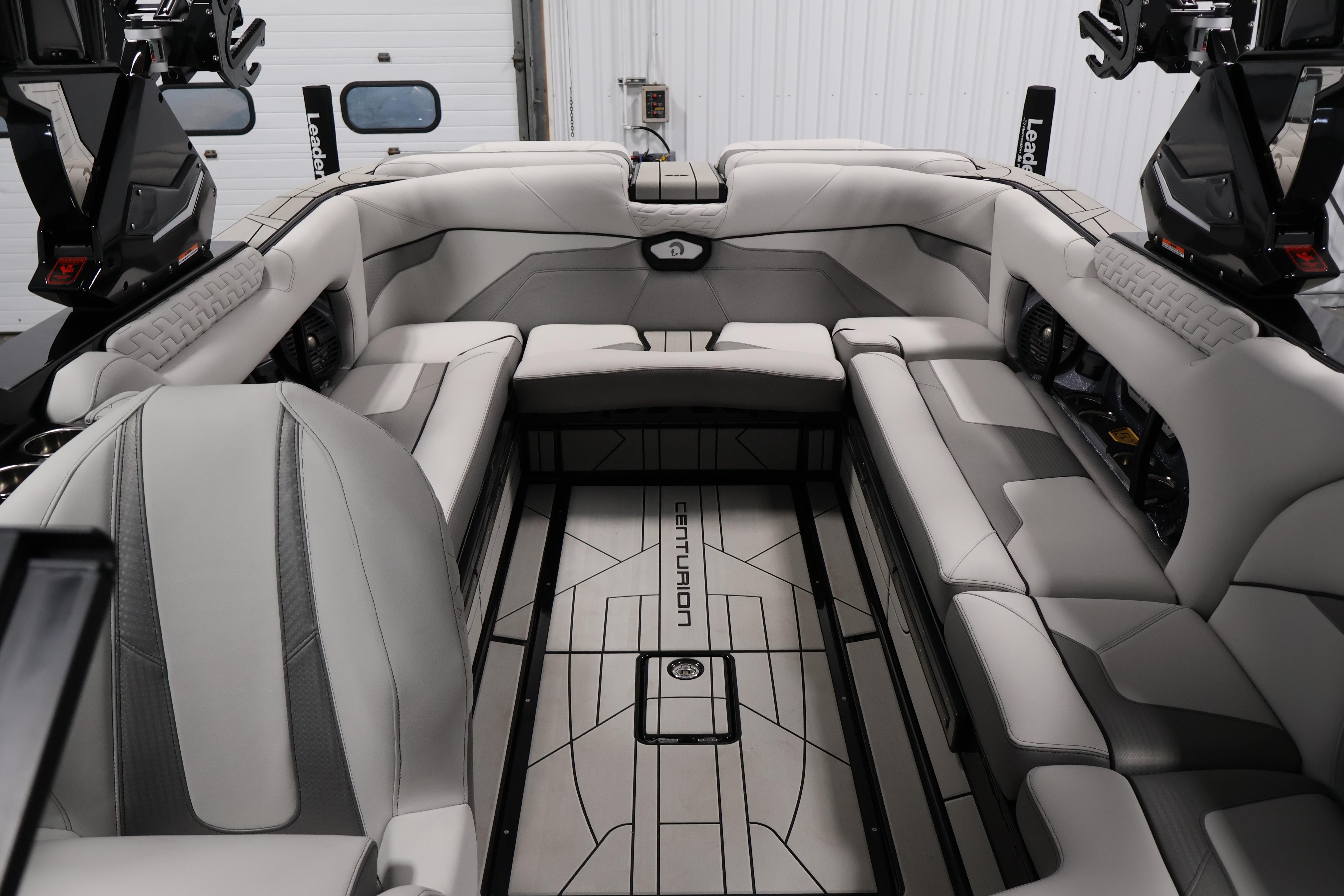 Luxurious interior of 2026 Centurion Ri245 boat with sleek seating and modern design.