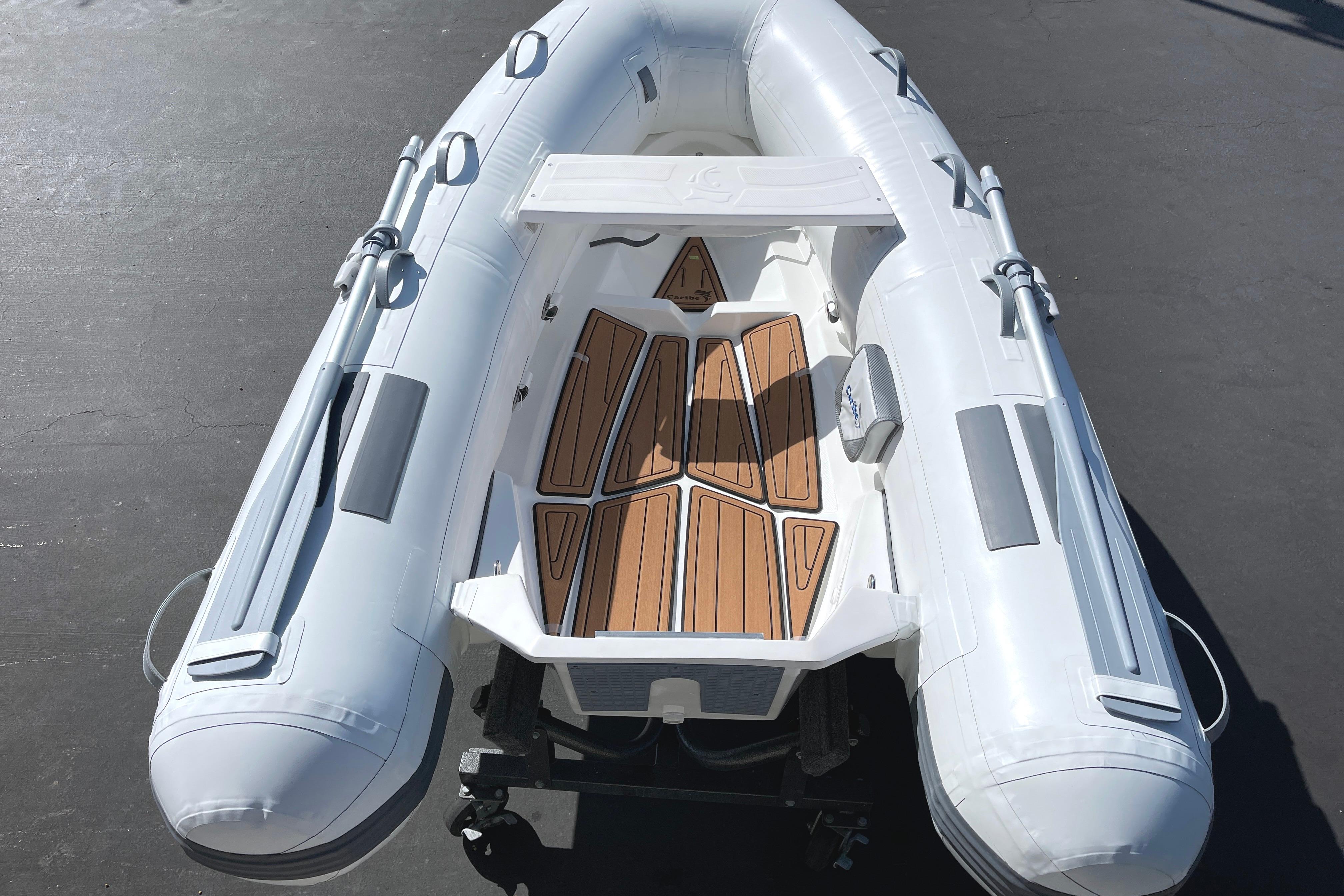 2025 Caribe L8 inflatable boat with wooden deck, viewed from above.