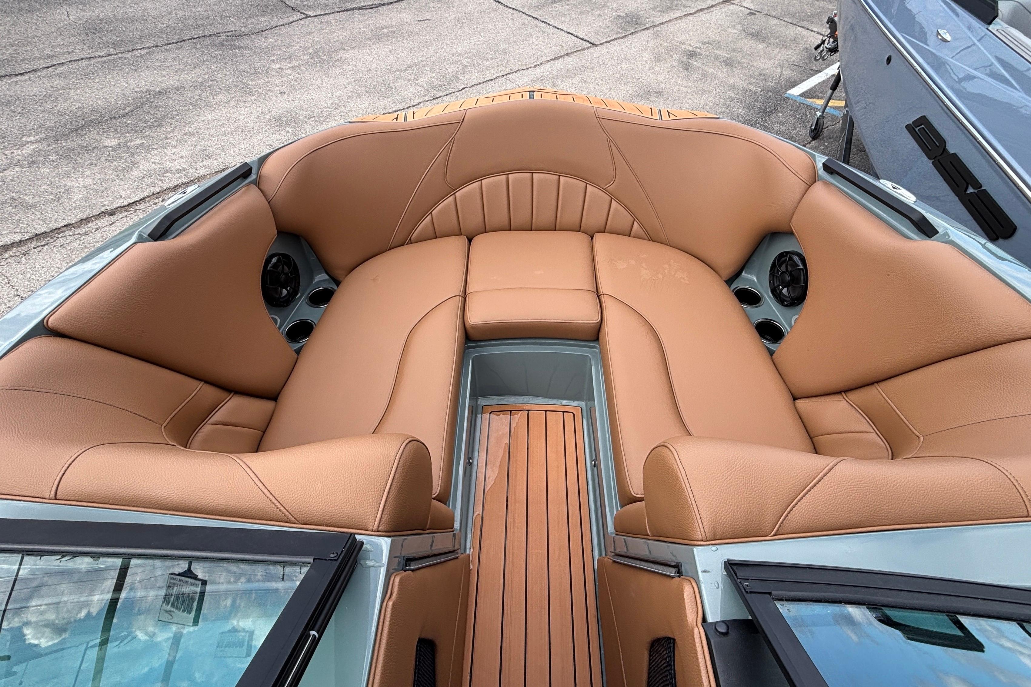 Luxurious interior of 2026 MB B52 23 Classic boat with tan leather seating.