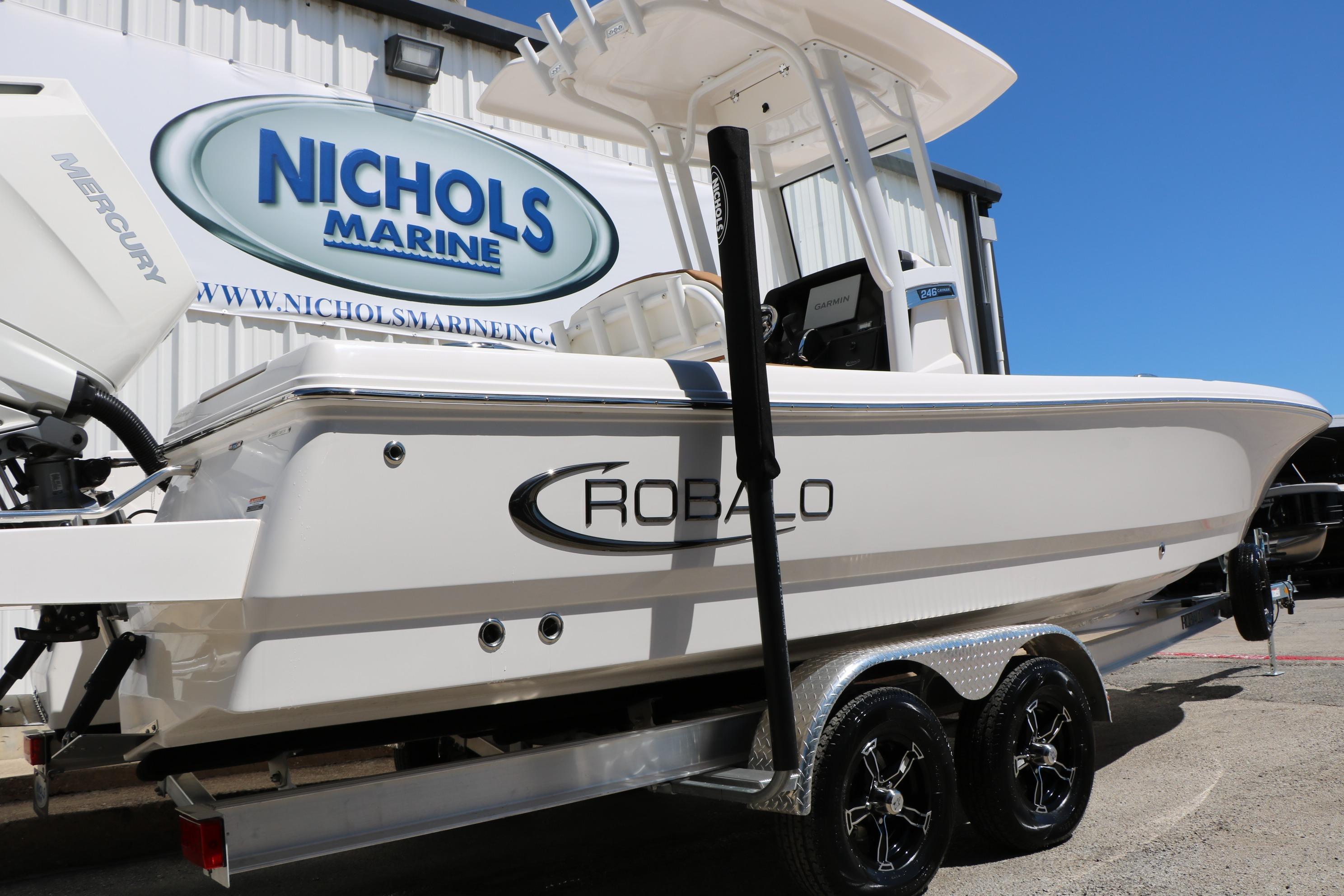 2026 Robalo 246 Cayman boat on trailer at Nichols Marine dealership.