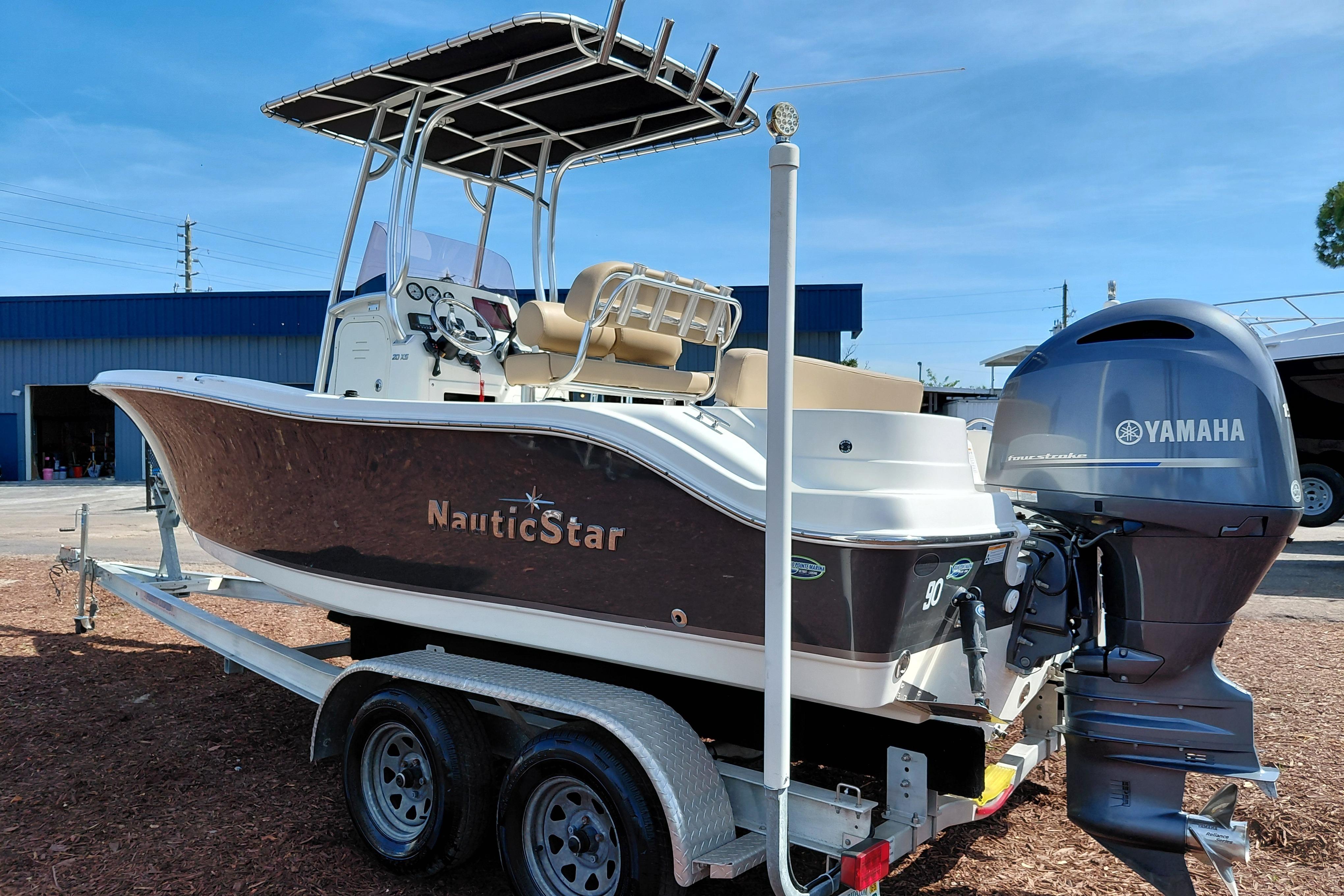 2020 NauticStar 20 XS boat with Yamaha engine on trailer, parked outdoors.