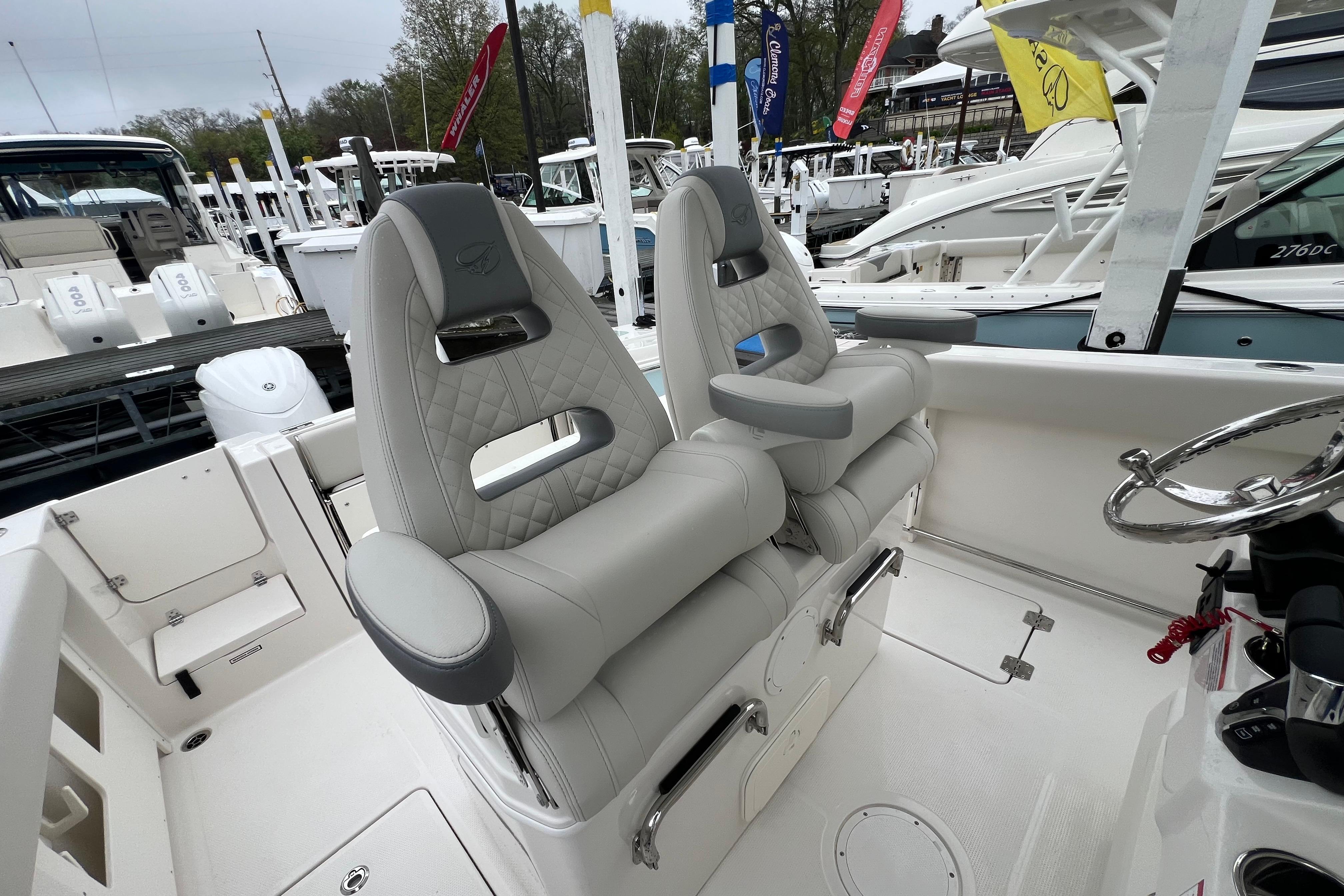 2026 Sailfish 272 CC boat interior with luxurious seating and modern steering wheel.